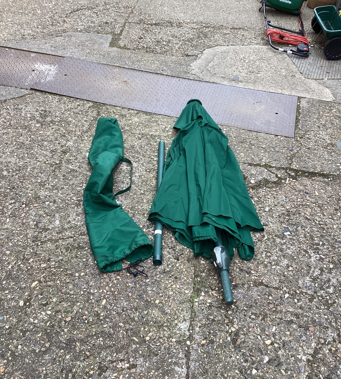 Large garden parasol with cover