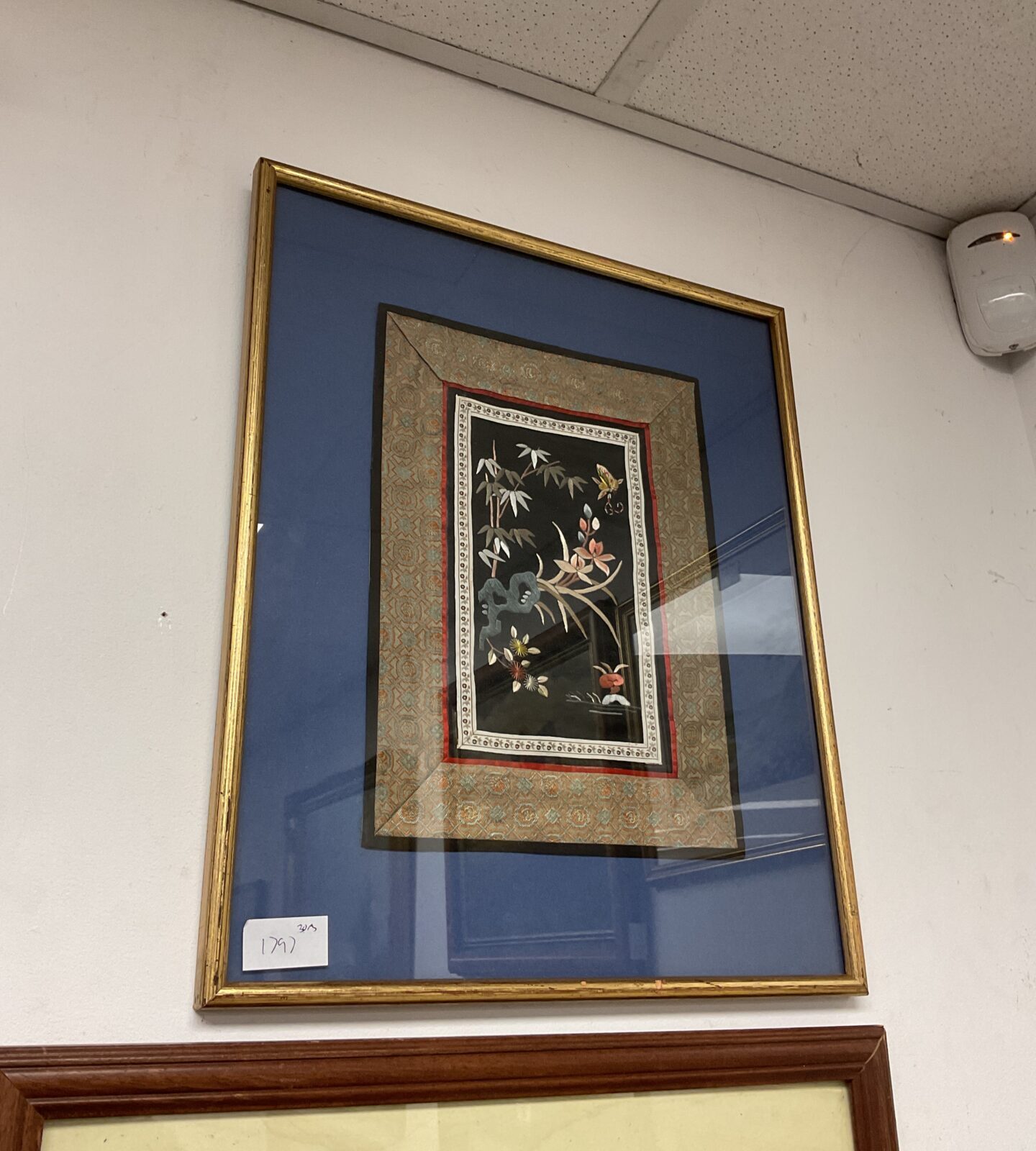 Framed oriental embroidery on silk