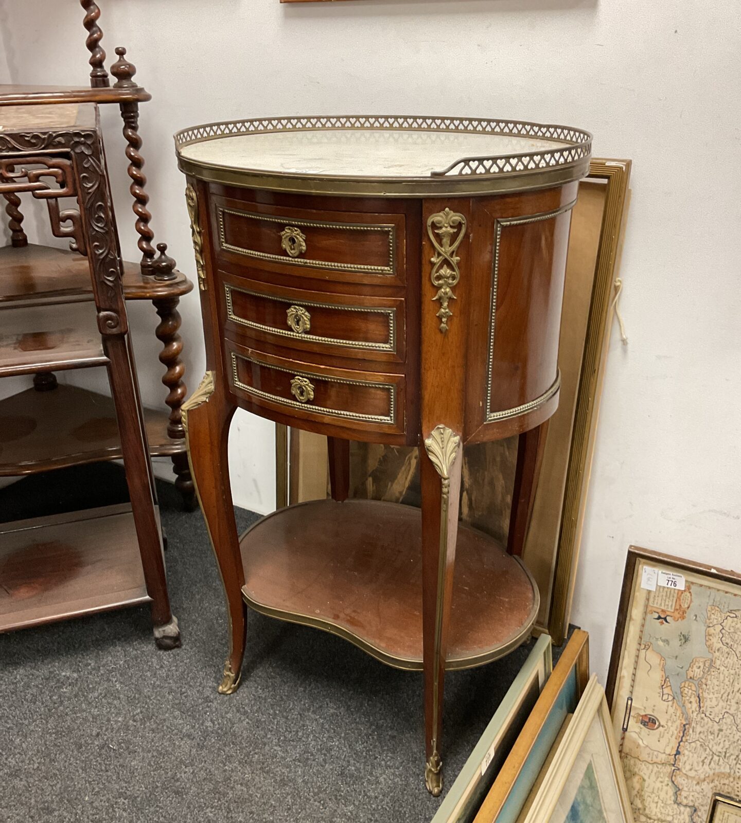 French mahogany oval marble topped three drawer table with pierced brass gallery