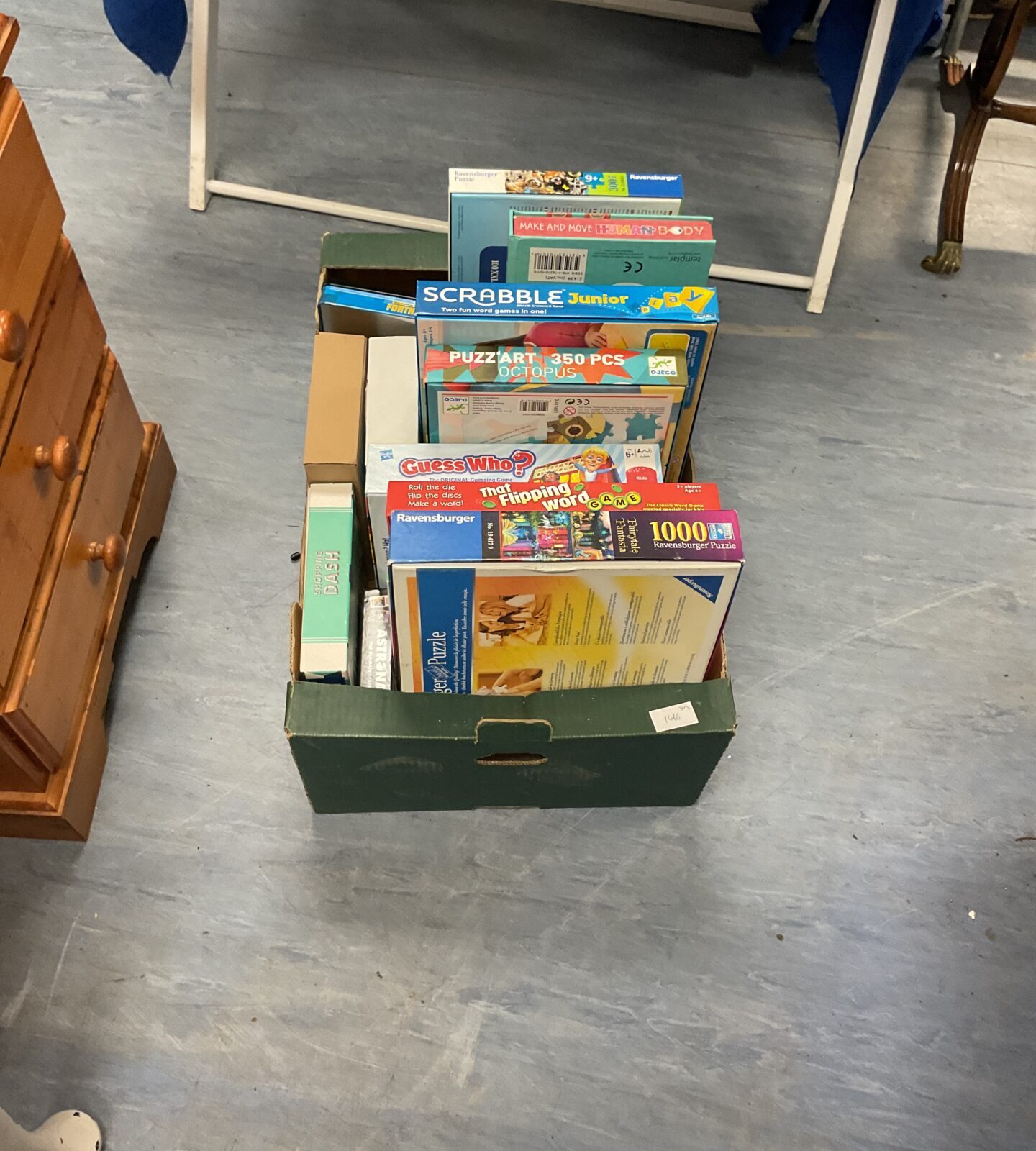 Crate of mixed board games and puzzles