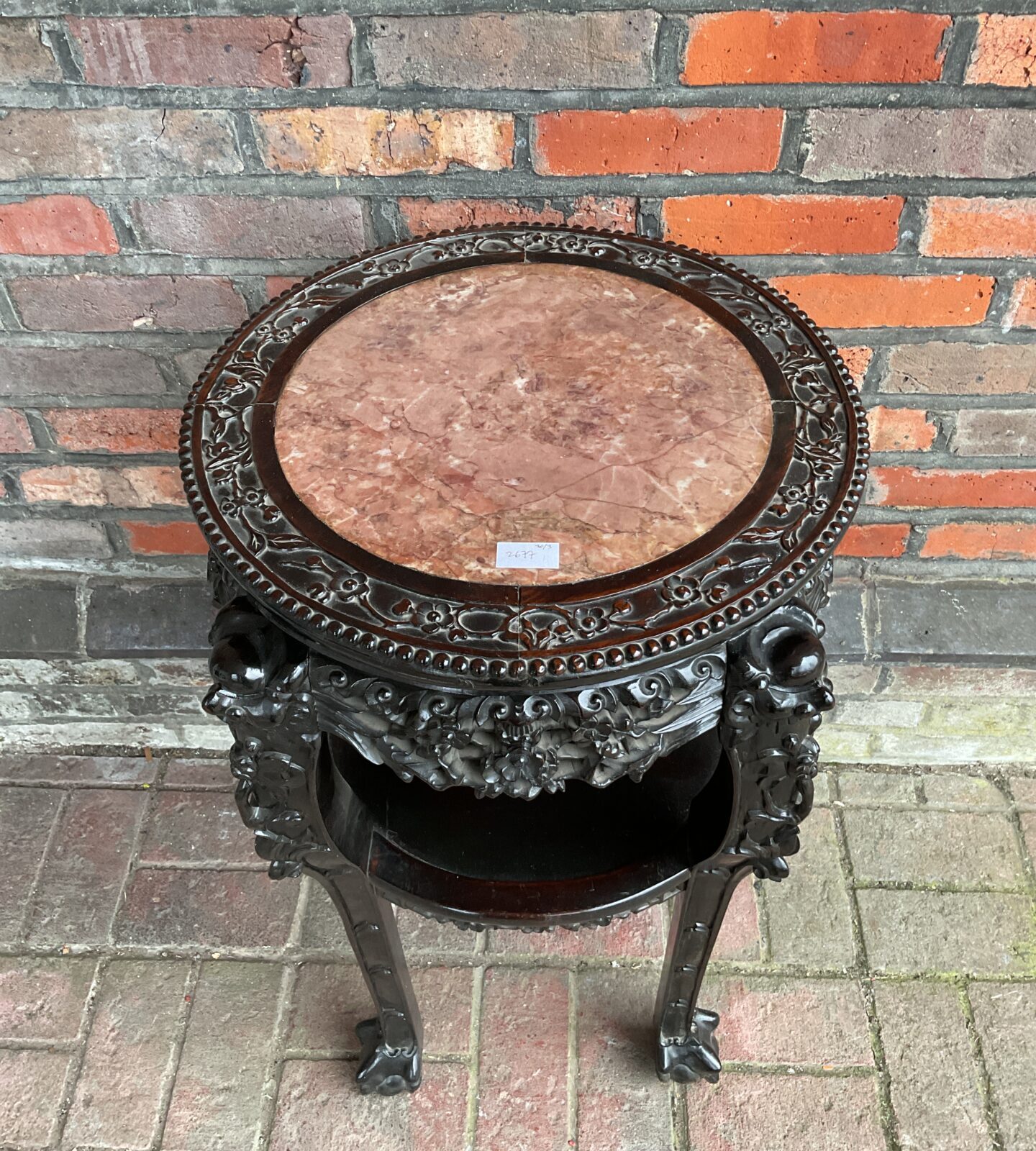 Chinese hardwood two tier circular occasional table with inset marble top with heavily carved frame - Image 2