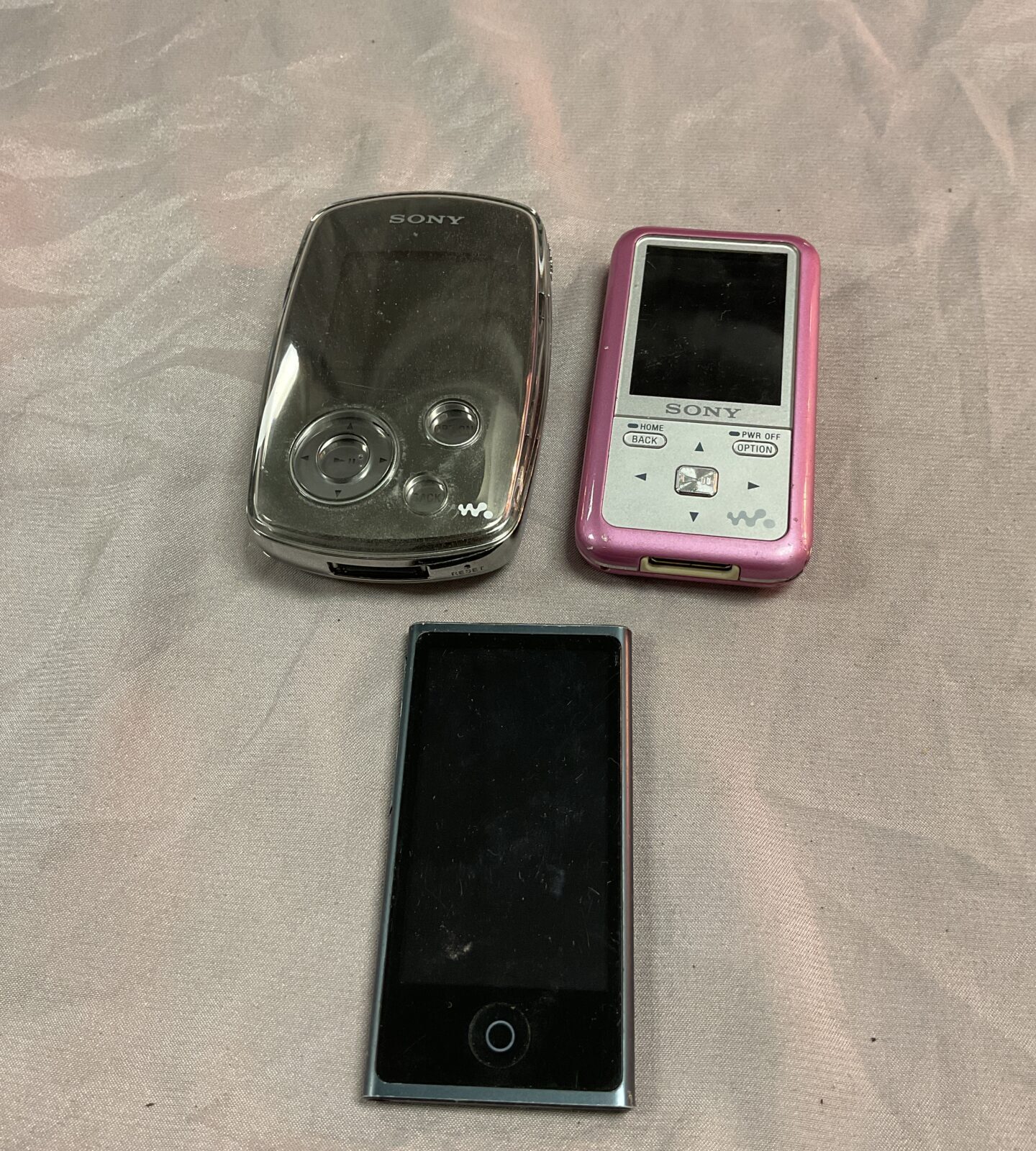 Two Sony Walkmans and Apple ipod