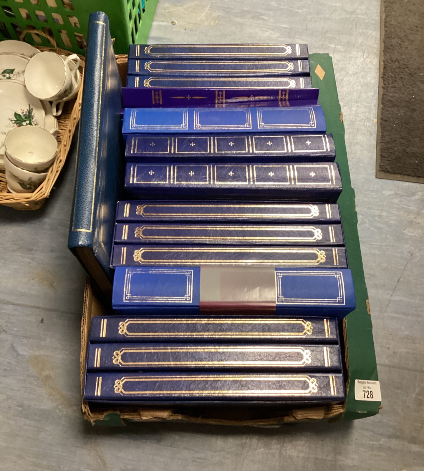 Box of blue leather bound photo albums
