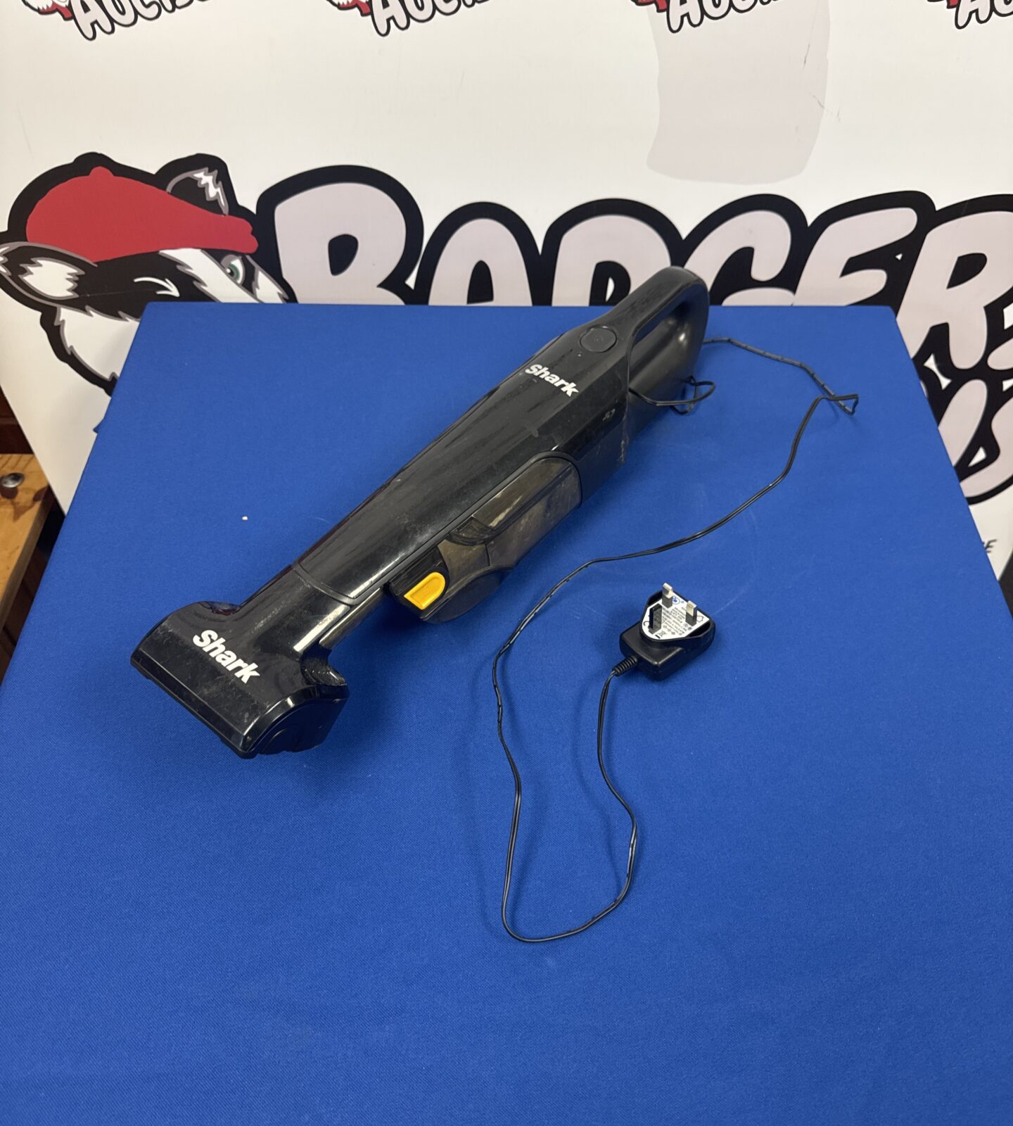 Shark cordless dustbuster with charger - powers on