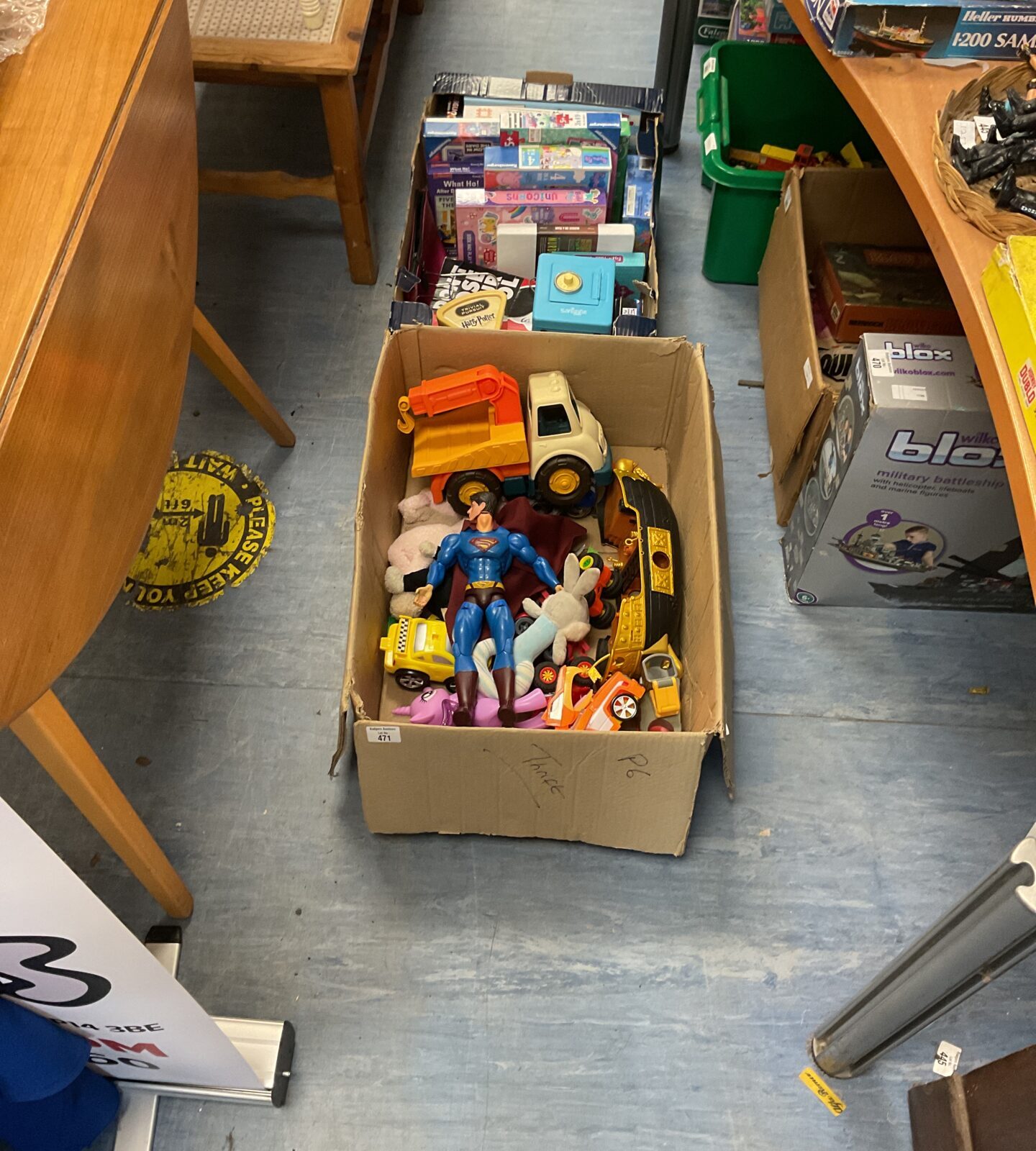 Two boxes of mixed toys and games inc puzzles, superman and cars