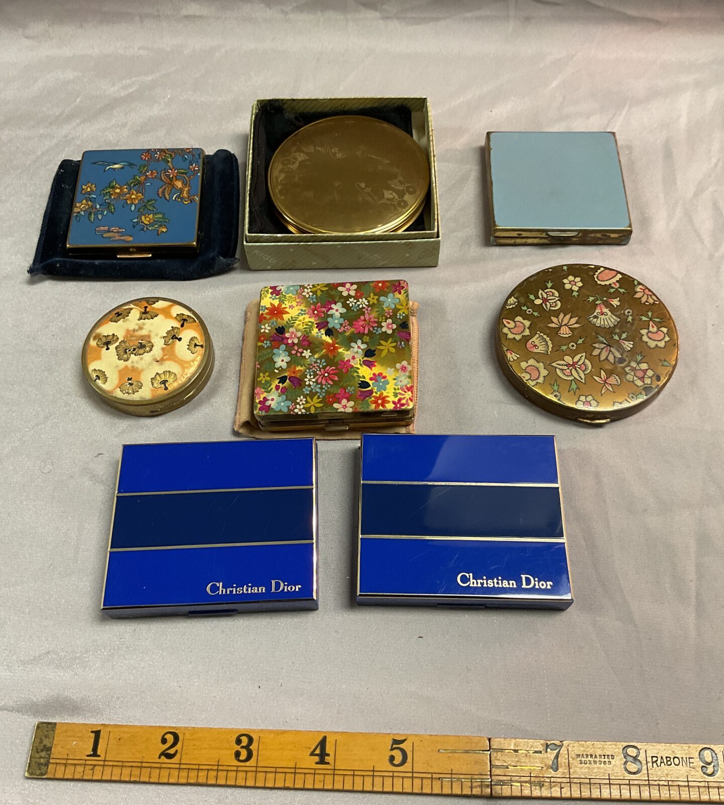 Eight vintage compacts inc Christian Dior,coty,  kigu and vogue