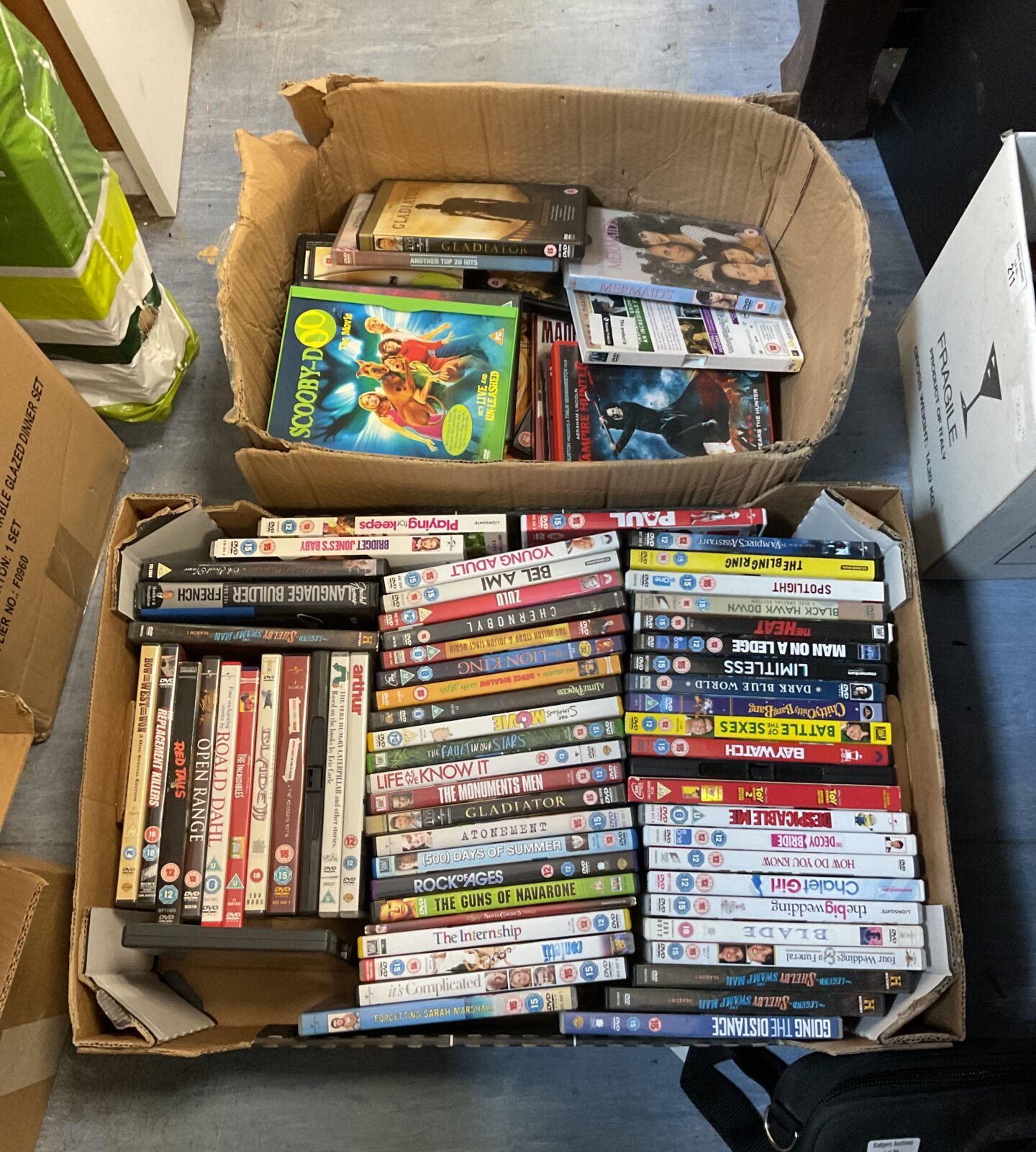 Two boxes of dvd movies inc scooby doo