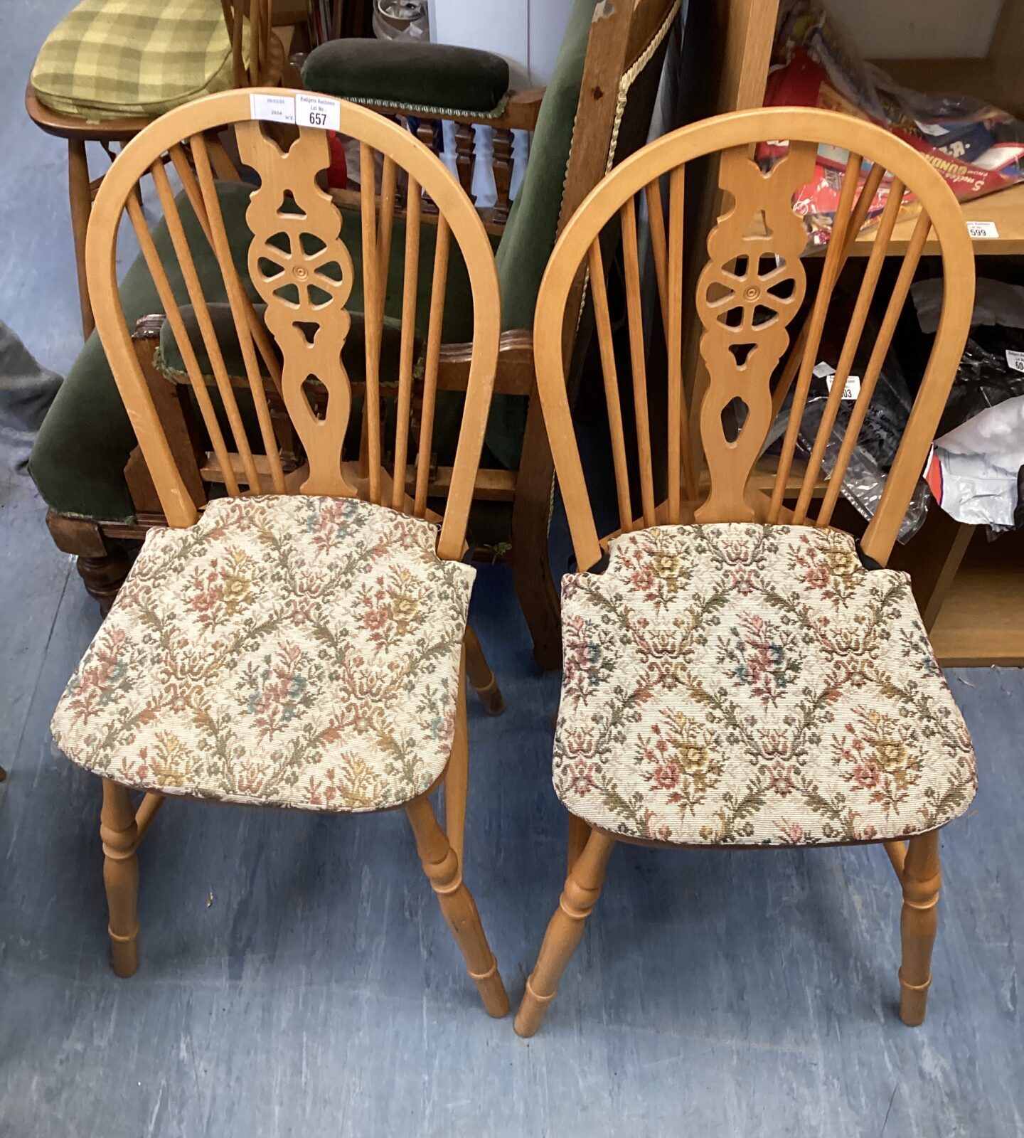 Two wheel back dining chairs