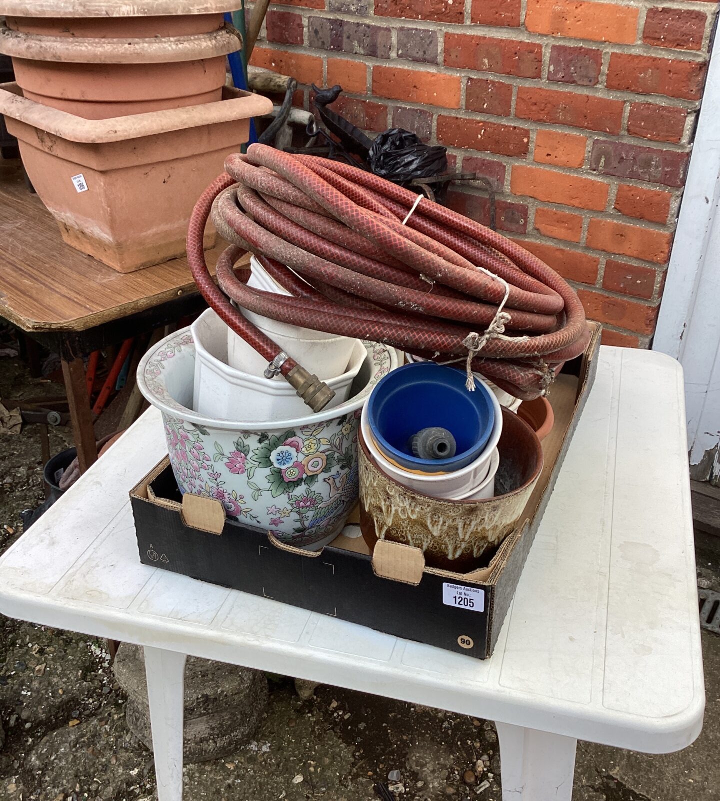 Quantity of flower pots with garden hose