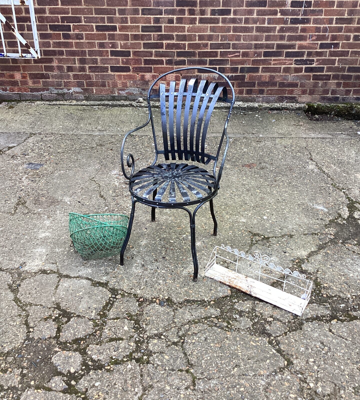 Metal garden chair with flower baskets