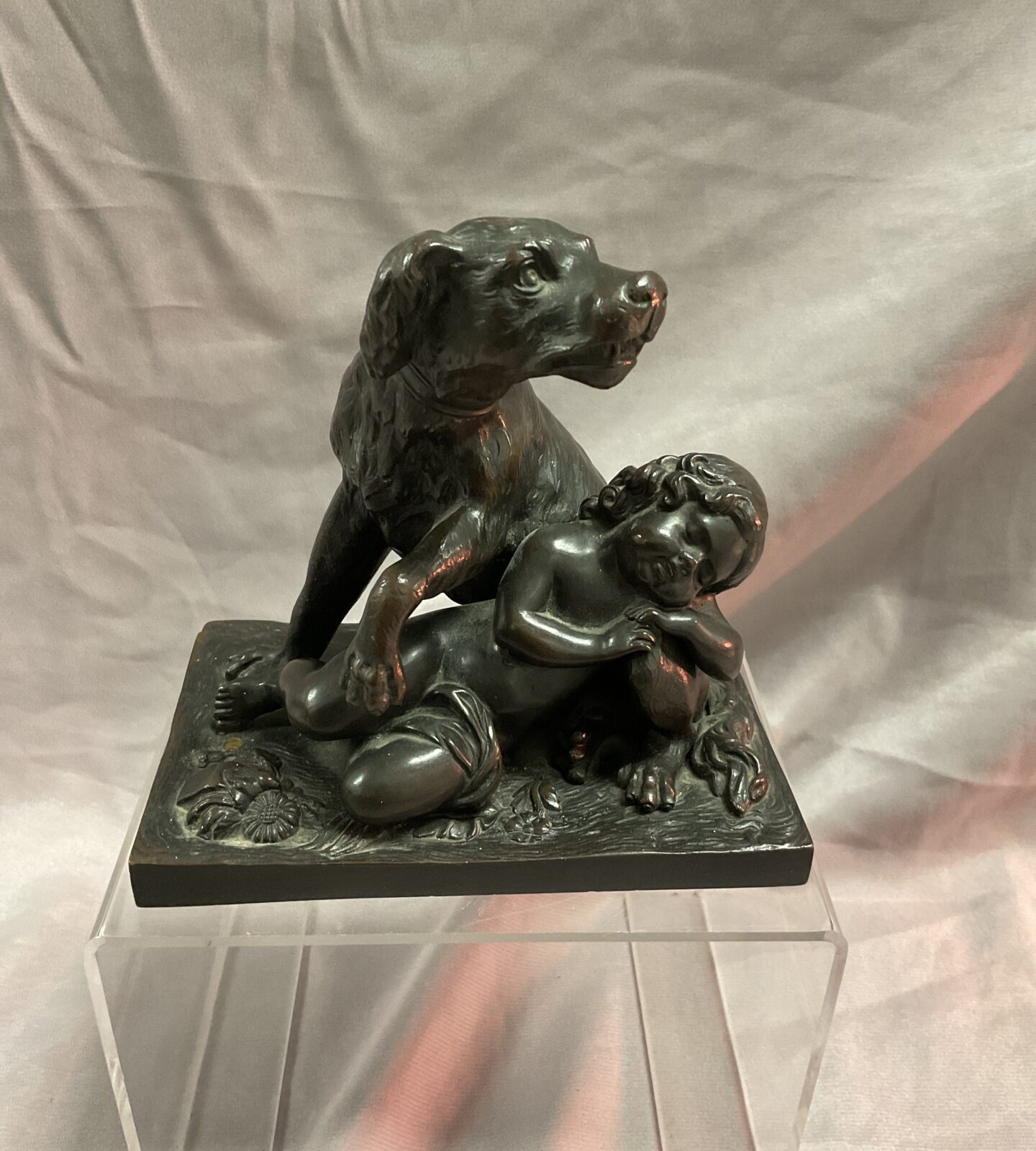 20th century bronze figure of a dog guarding a child