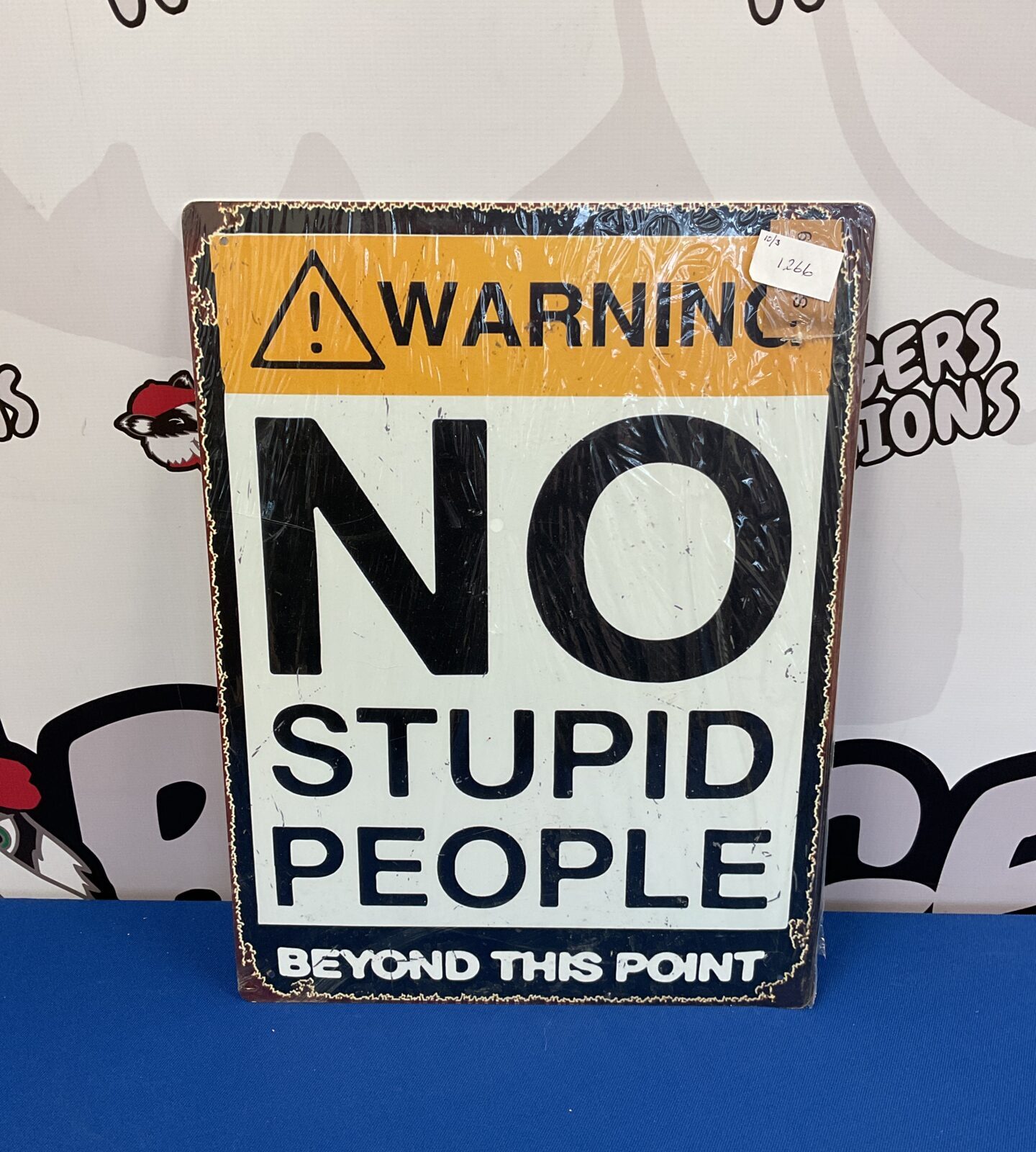 Warning no stupid people beyond this point tin sign