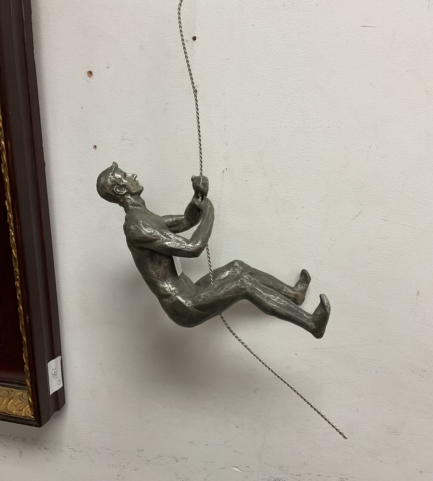 Cast metal rock climbing figure wall art