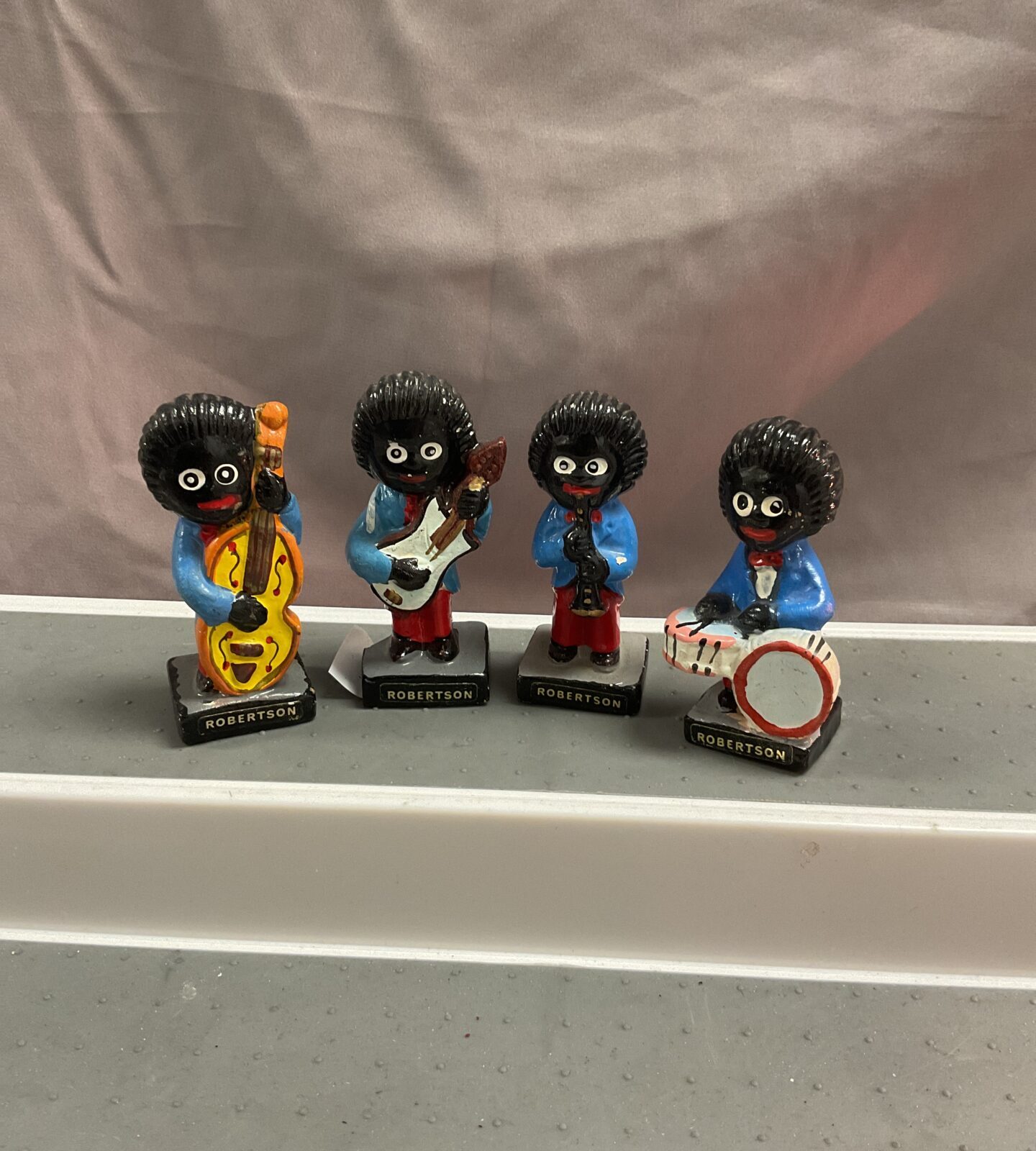 Four Robertson golly band figures