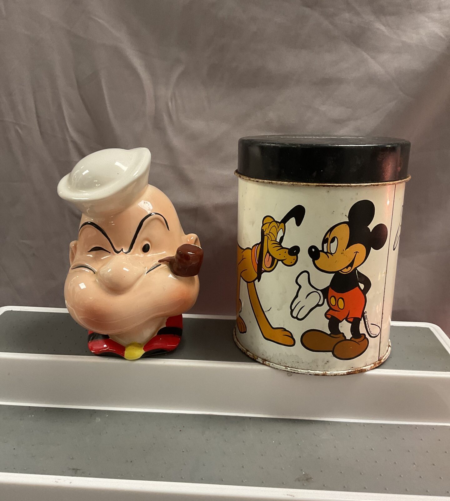 Vintage ceramic popeye money box and Mickey Mouse tin