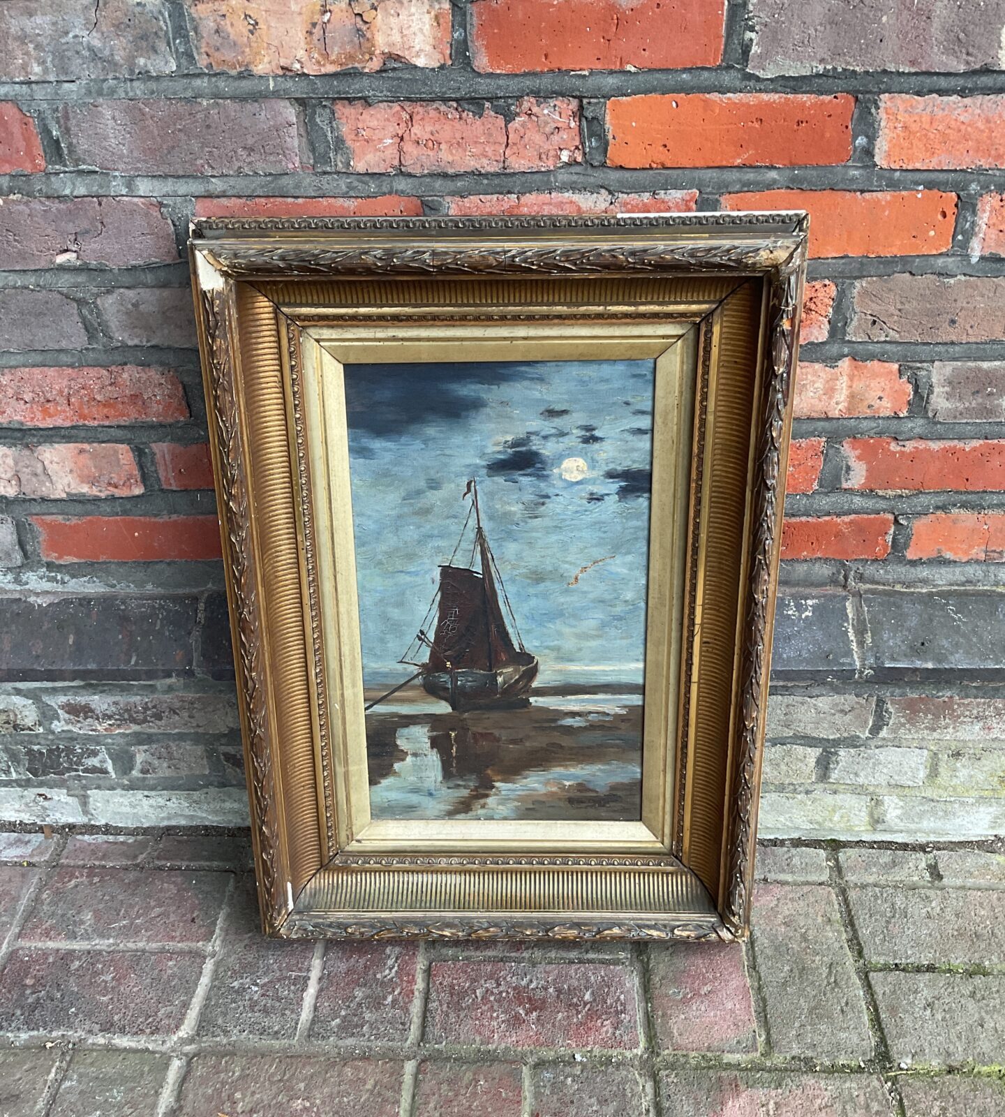 Antique gilt framed oil painting of a docked sail ship