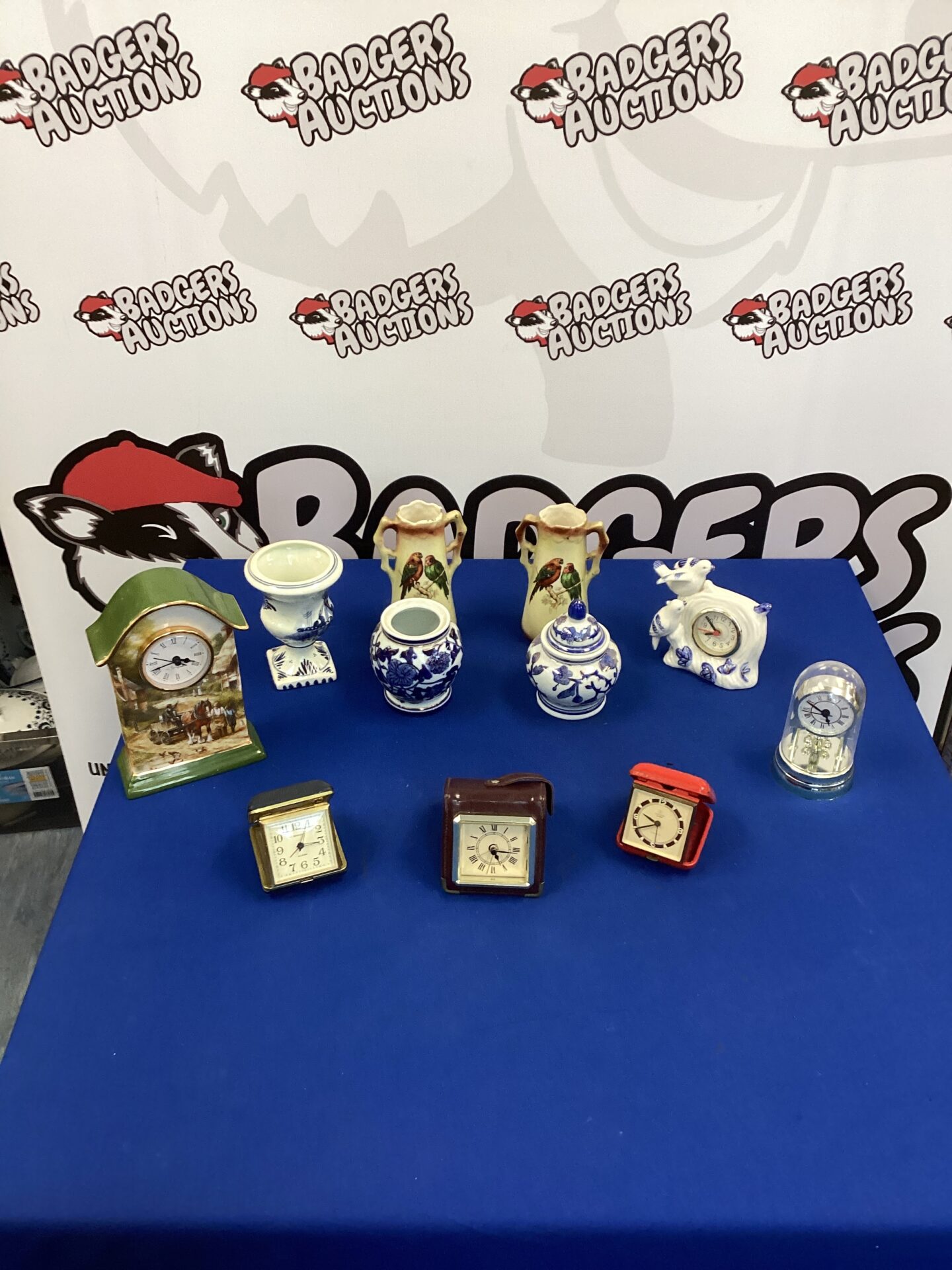 Box of mixed items inc travel clocks & delft