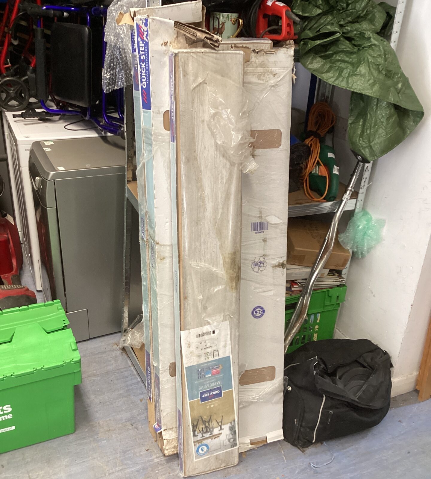 Five packs of uniclick grey laminated flooring panels