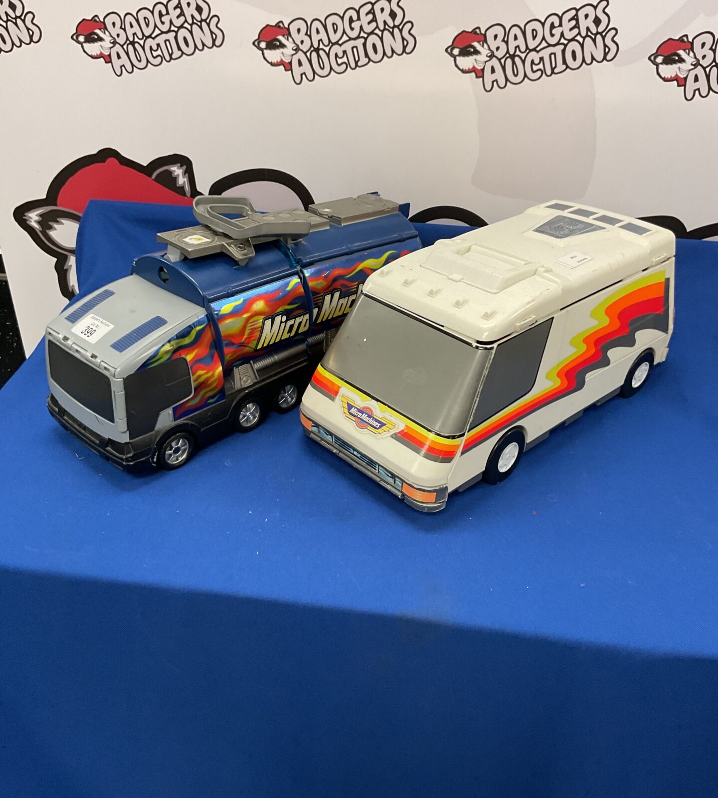 Two hasbro micromachines inc super stunt city semi vehicle tabker truck and super van city playset