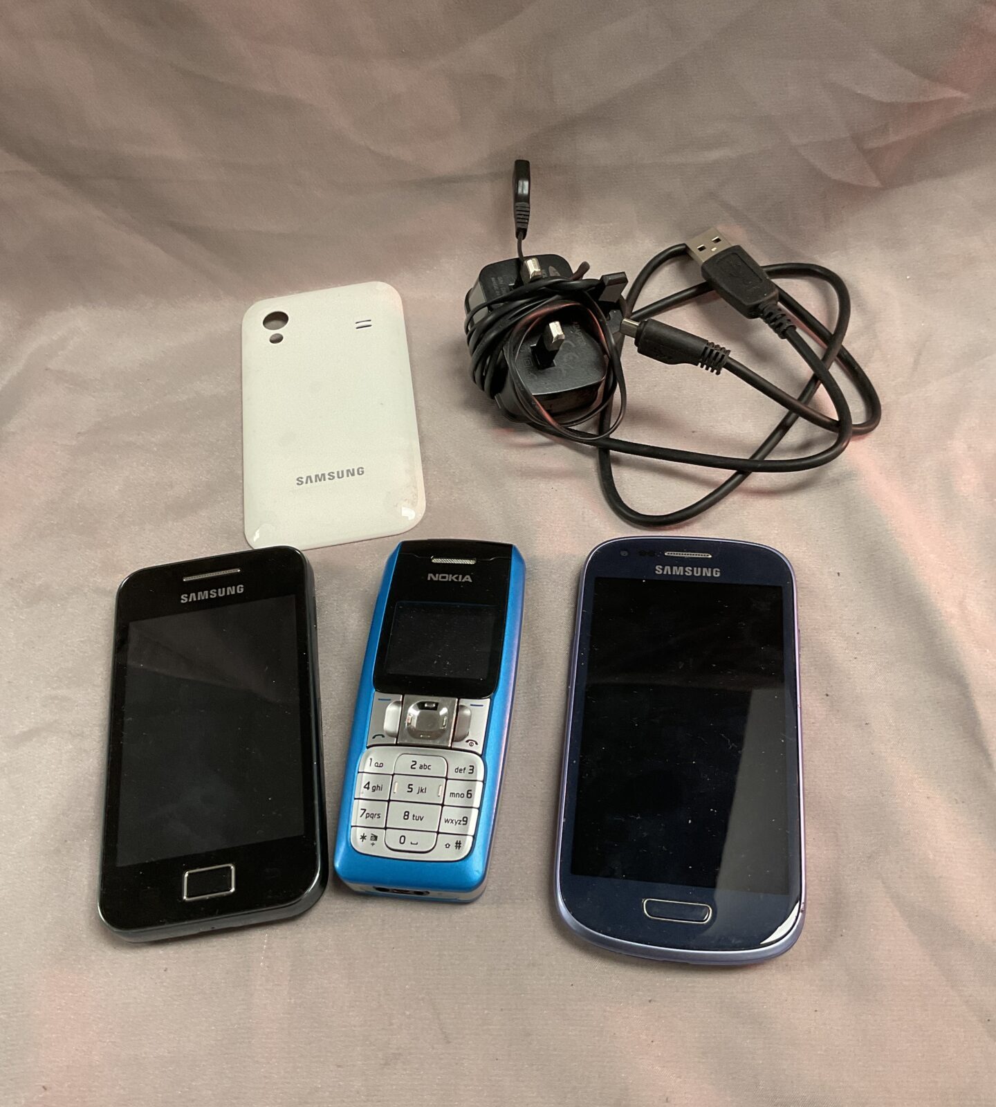 Two Samsung and a Nokia Mobile Phones