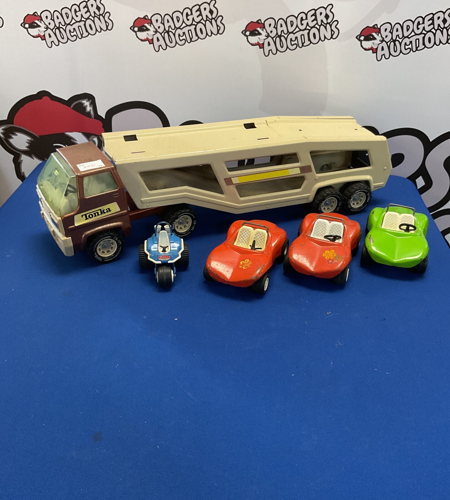 Vintage tonka diecast auto trailer truck with three vintage tonka fun buggies and Vintage Tinka three wheeled trike
