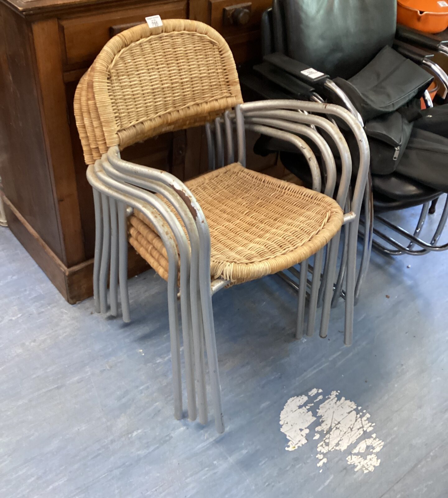 Four vintage stackable raffia and metal chairs