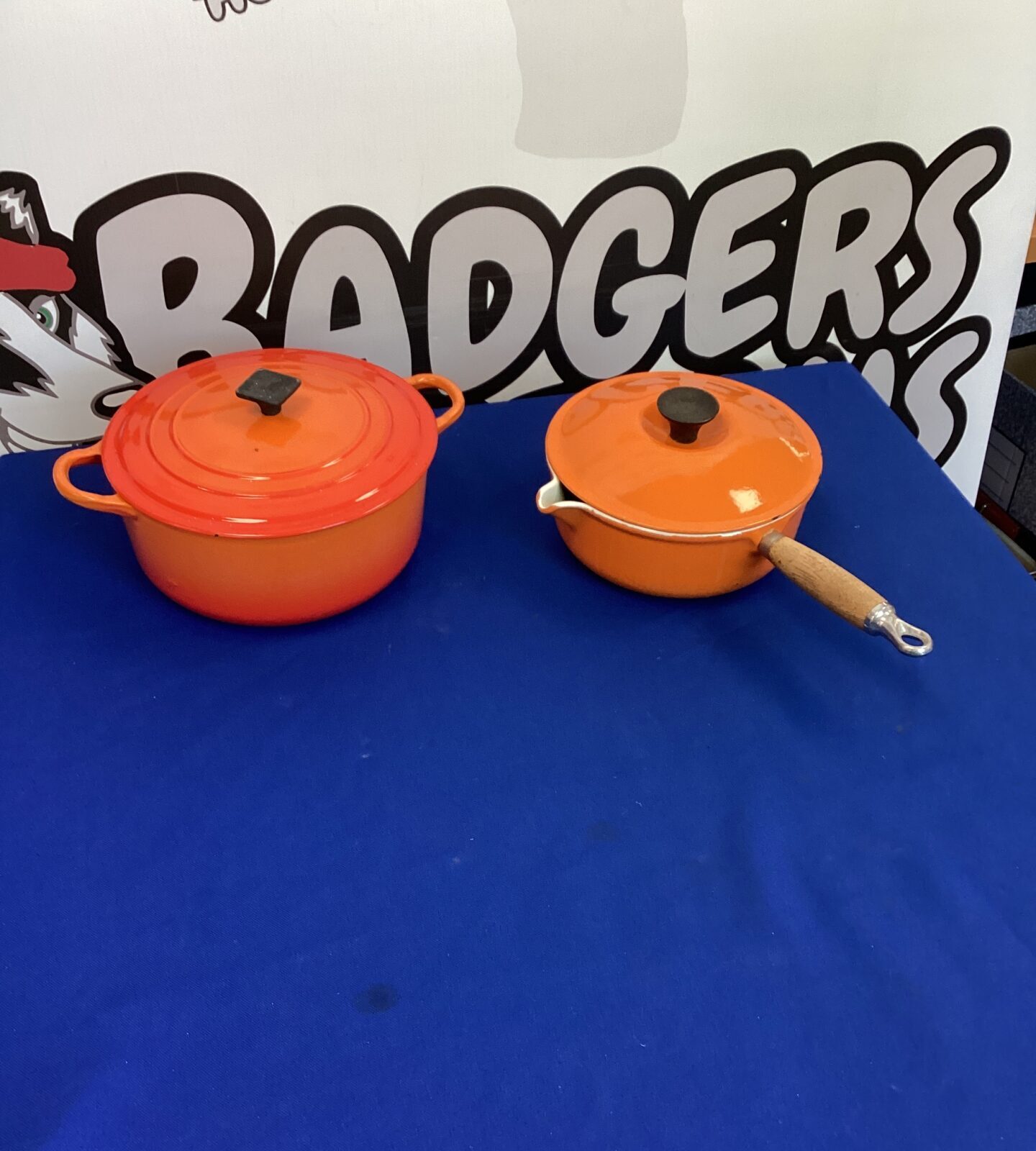Two Le Creuset Orange Pans