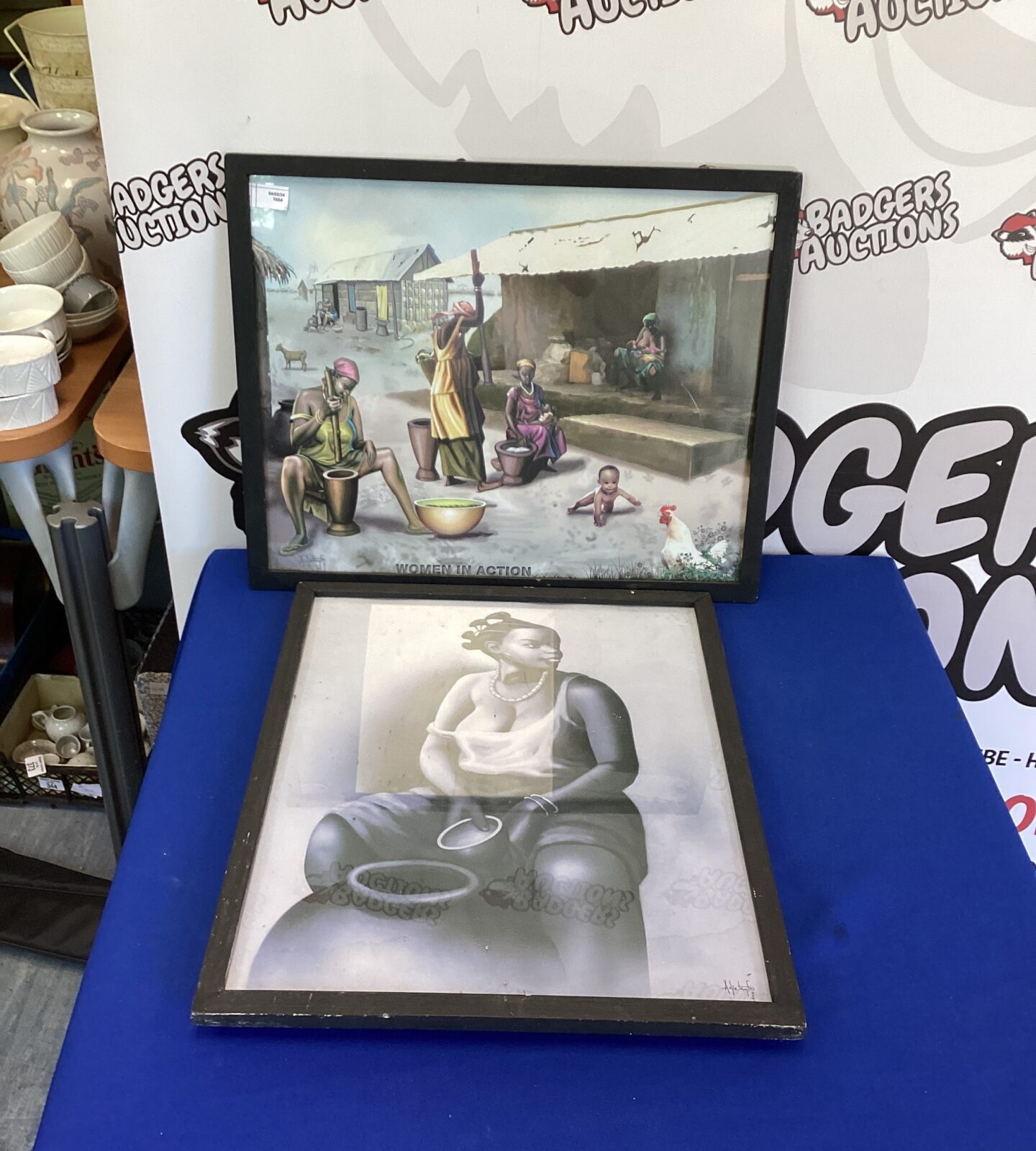 Two framed Afican women at work art
