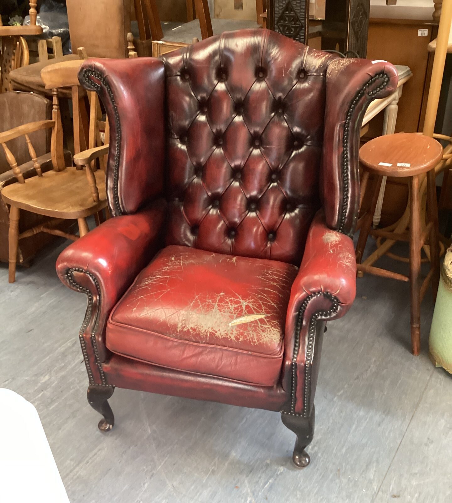 Chesterfield style red leather wingback chair