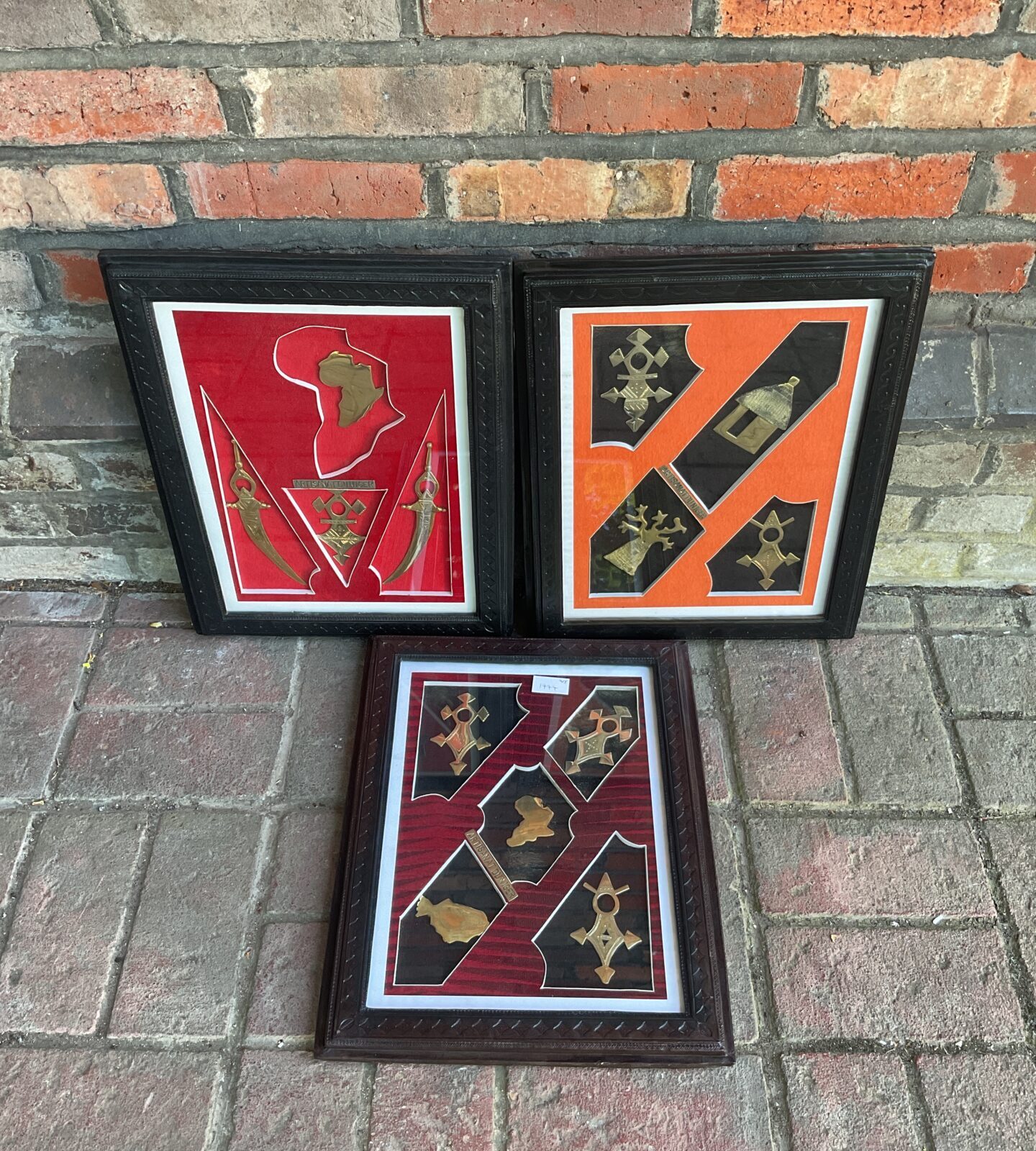 Three leather framed sets of artisanat du niger brass african art