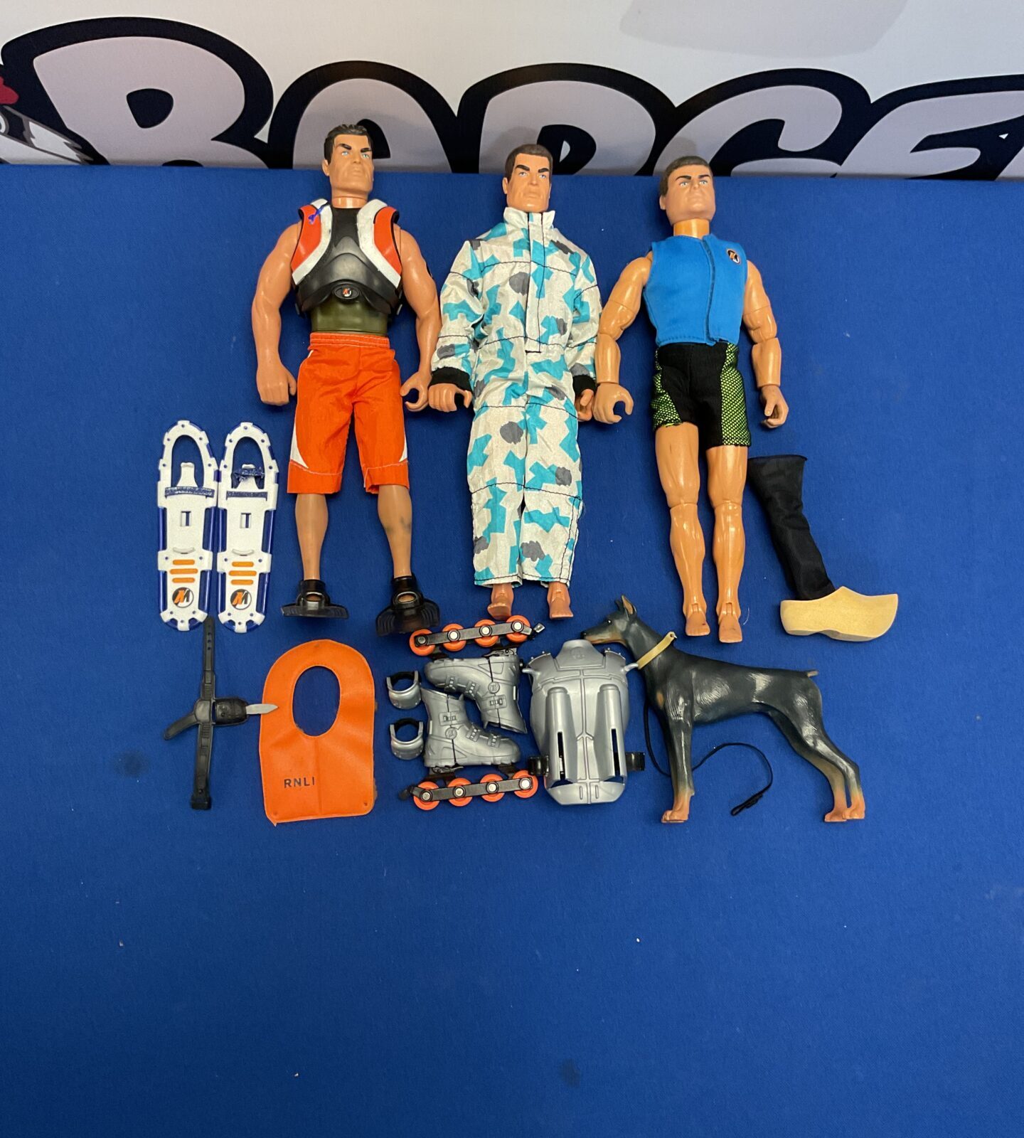 Three 1990’s action man figures with accessories and gi joe doberman