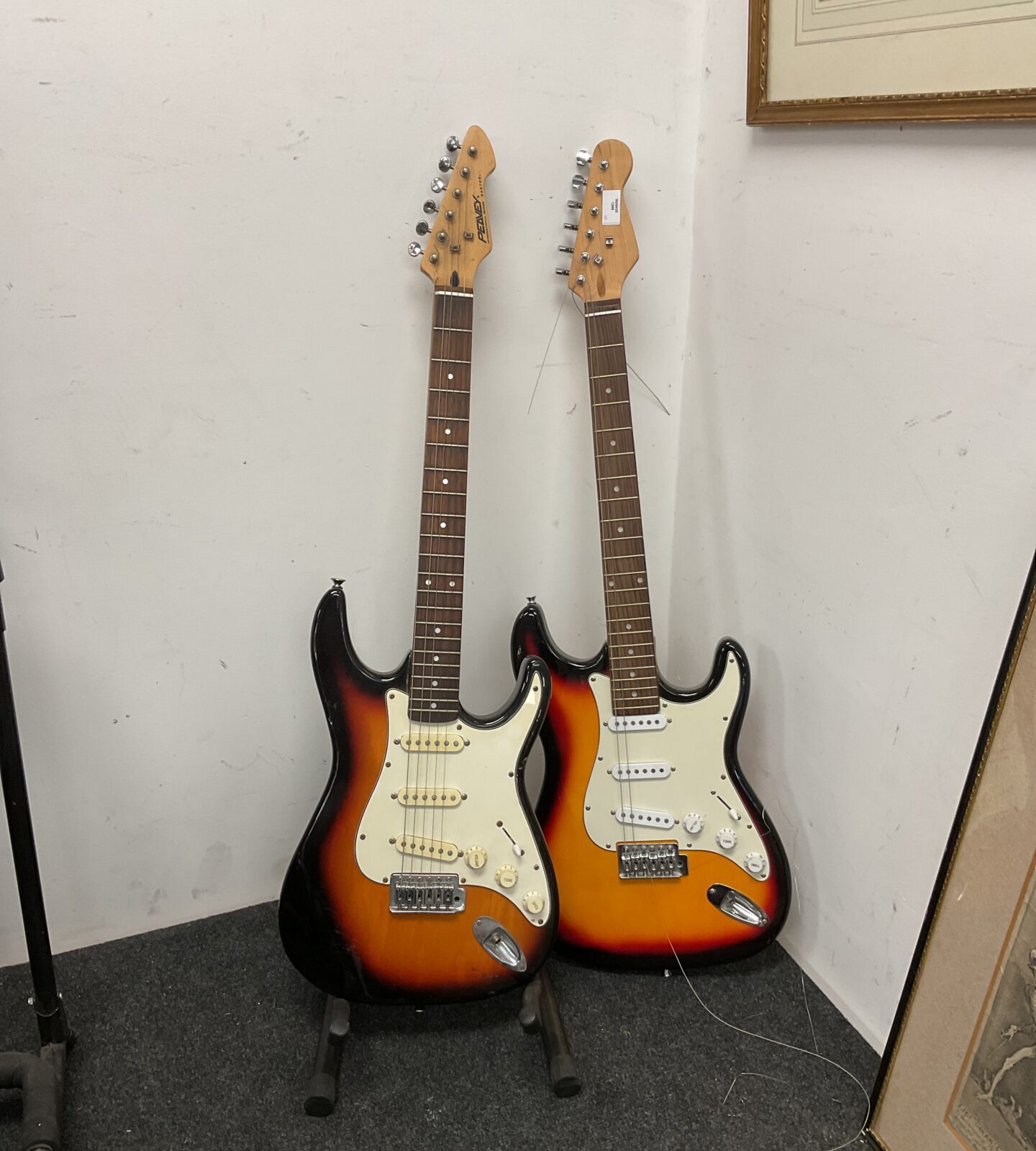 Two sunburst electric guitars inc peavey