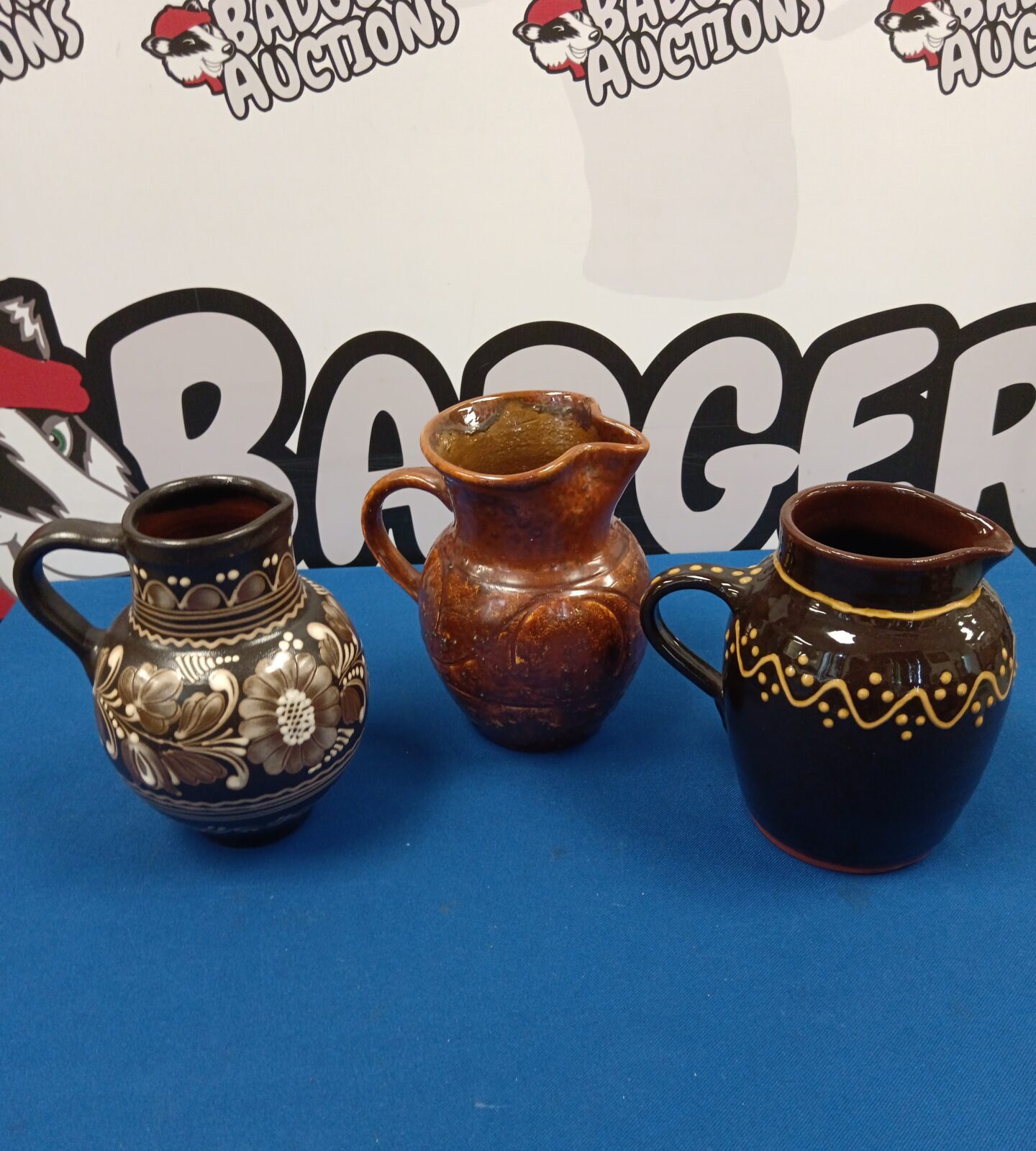 Three art pottery jugs