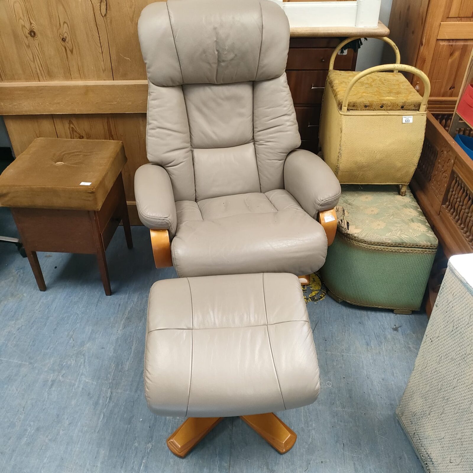 Grey leather recliner chair with foot rest