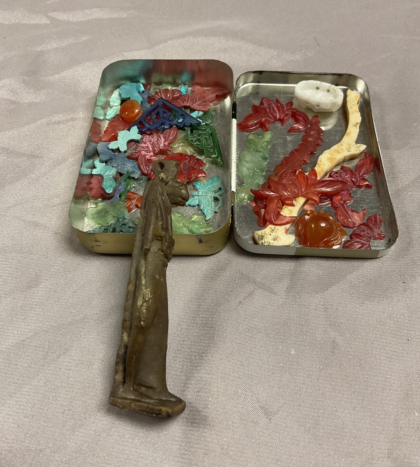 Tin of jadeite decorative items and Egyptian God Amulet? - Image 3
