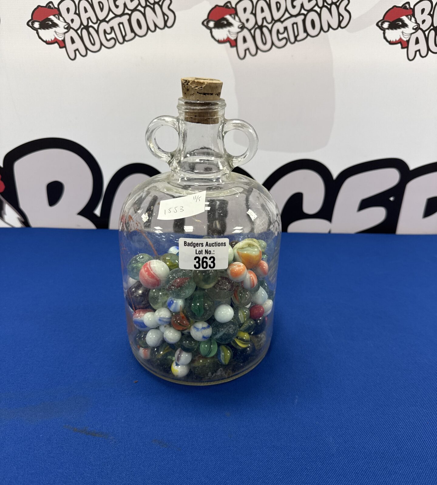 Cider bottle full of vintage marbles