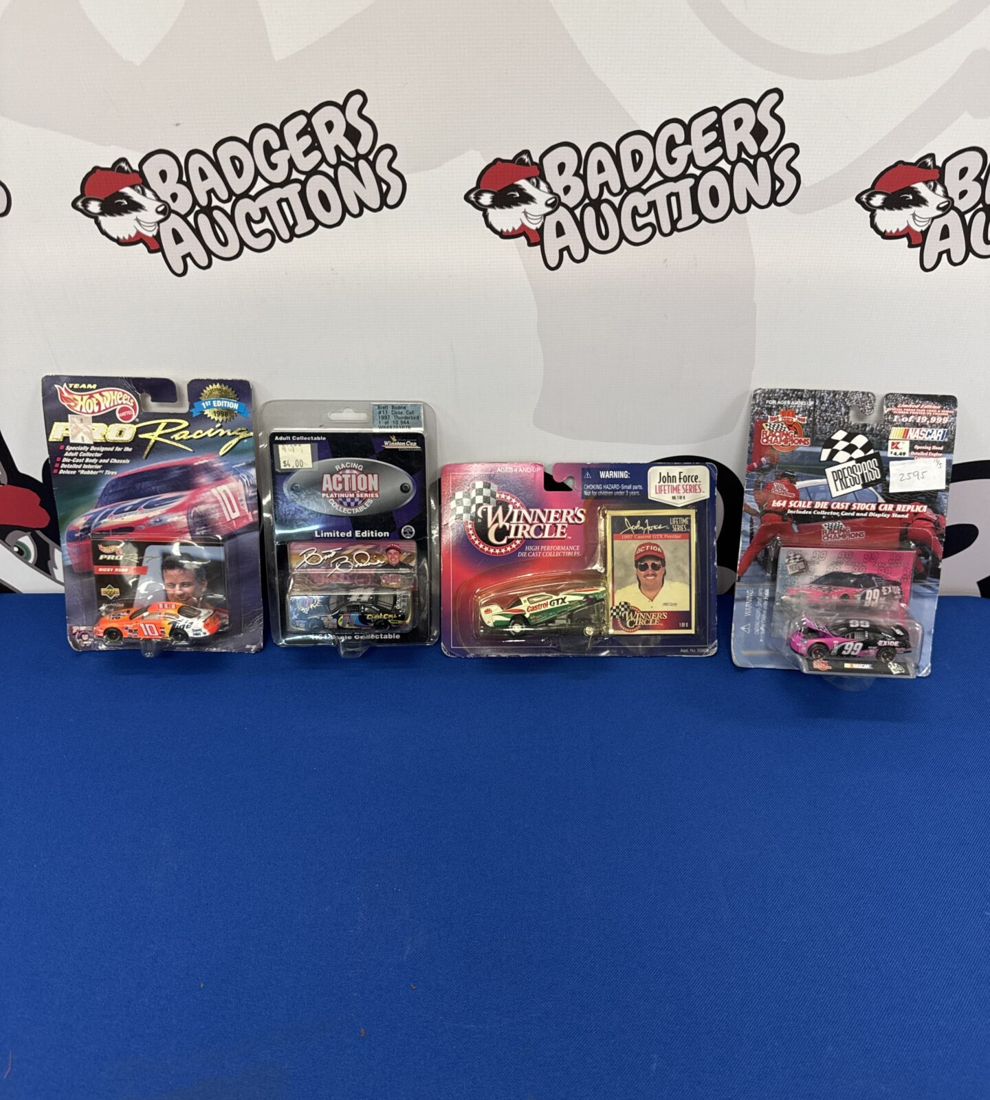 Four sealed nascar die cast car models inc hot wheels