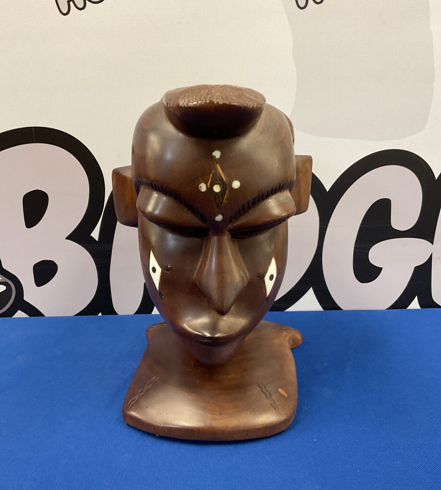 Large African carved bust of a tribesman with inlaid bone