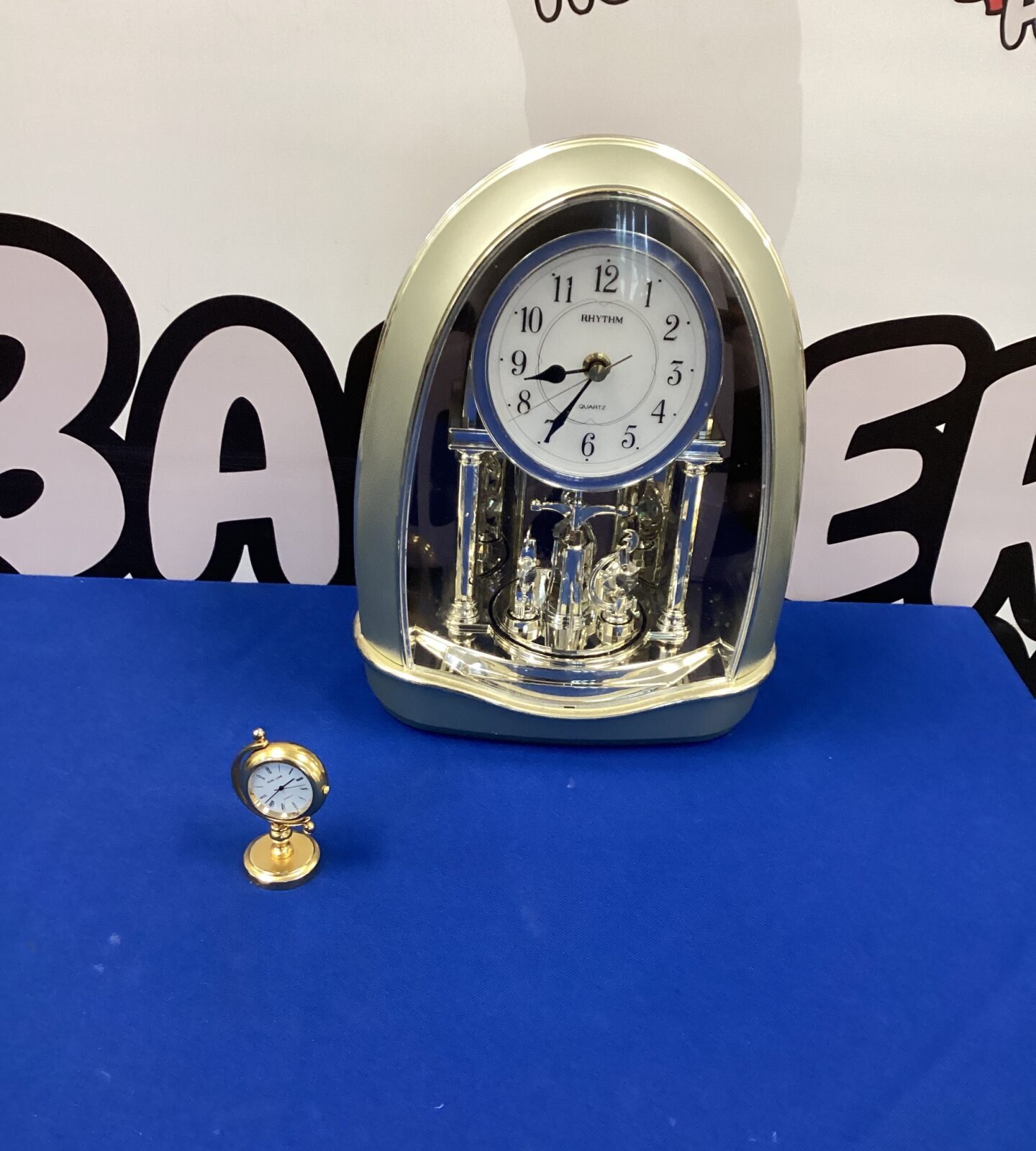 Two matle clocks inc large Rhythm clock