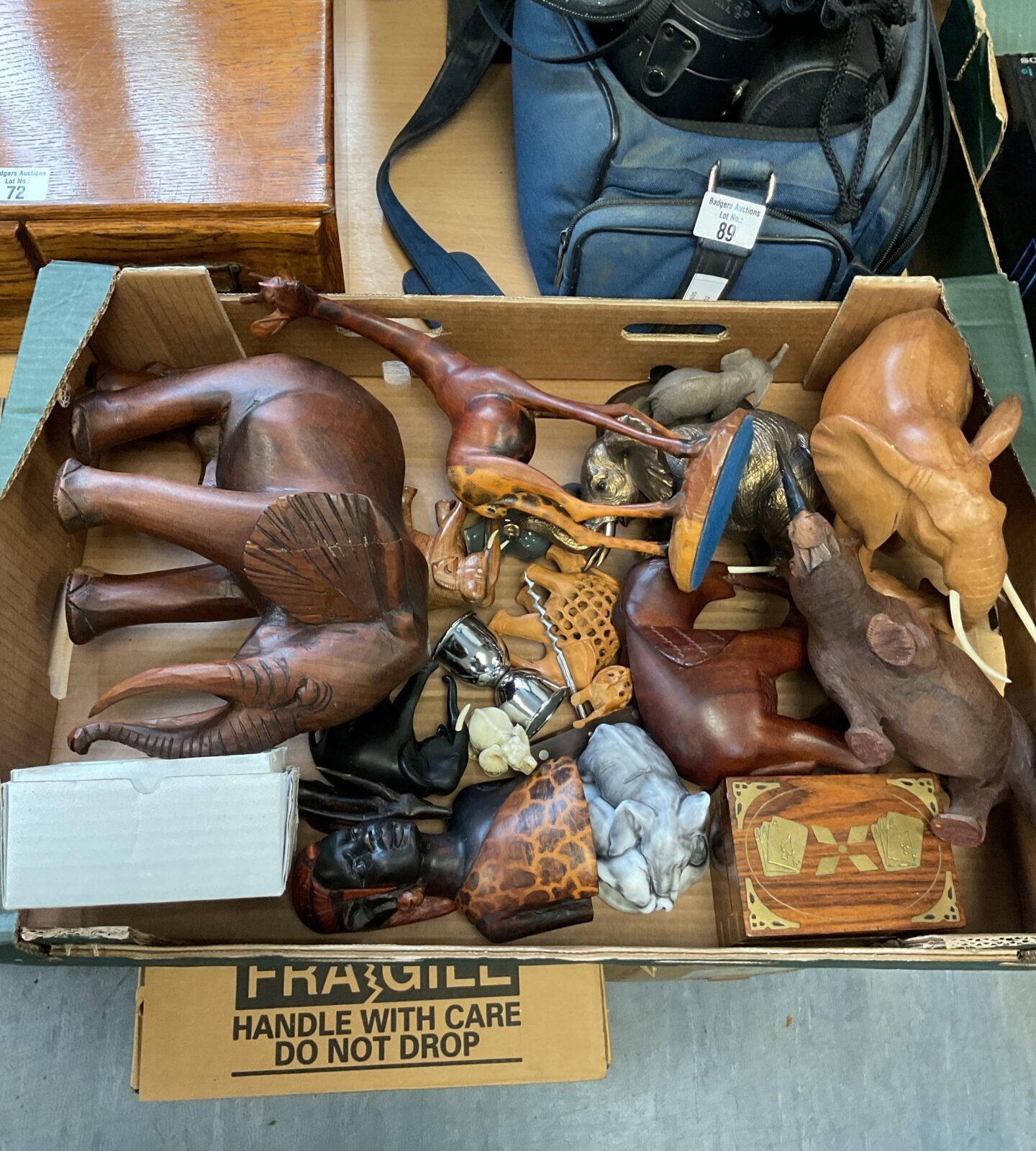Tray of carved wooden animals including elephants & giraffe