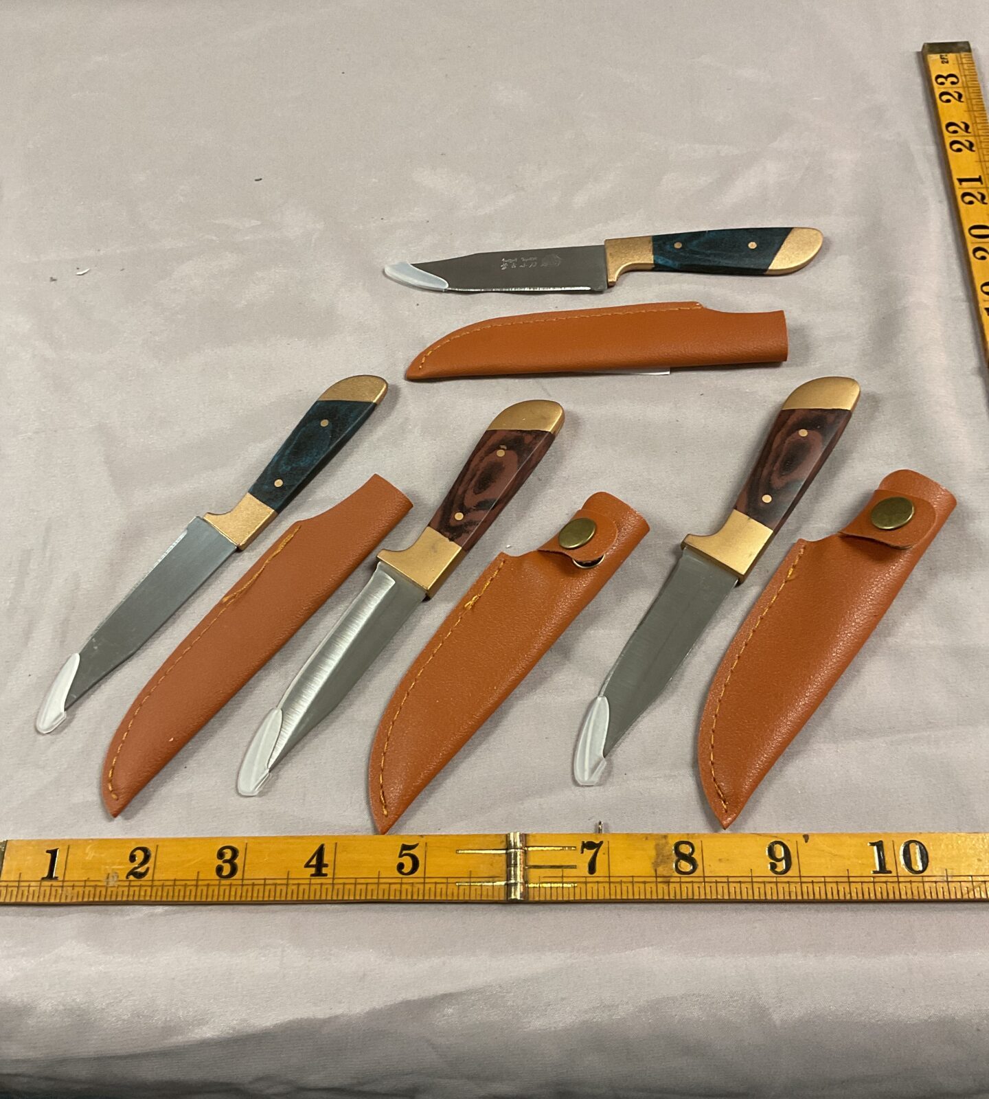 Four small sheath Knives