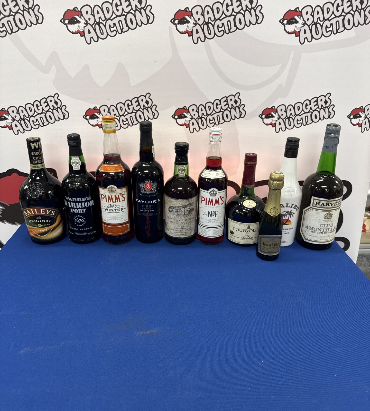 Ten bottles of assorted alcohol inc port, Malibu, baileys & others