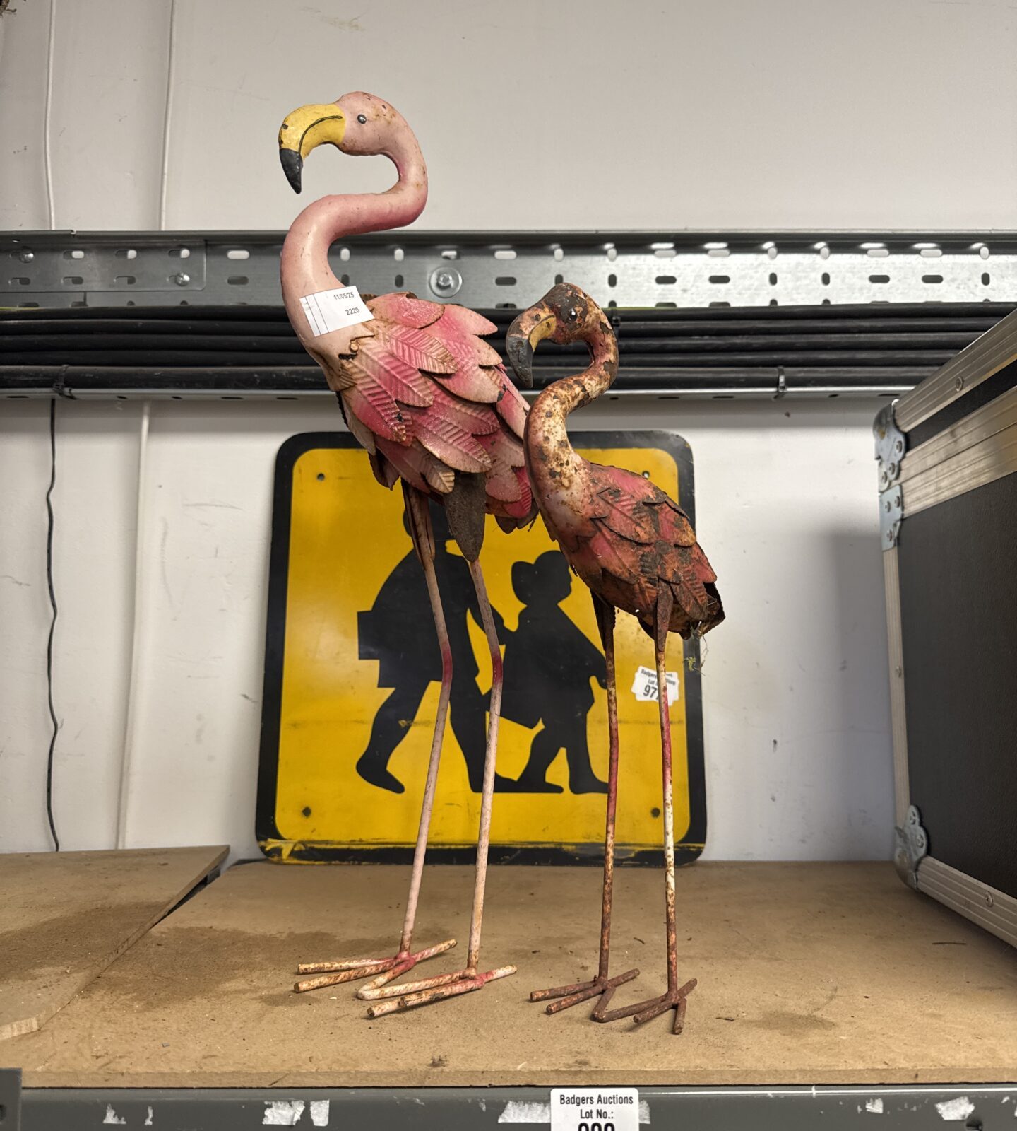 Two flamingo garden ornaments taller one 19” tall approx