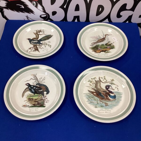 Set of four vintage Portmeirion bird plates, colourful ceramic collectible.