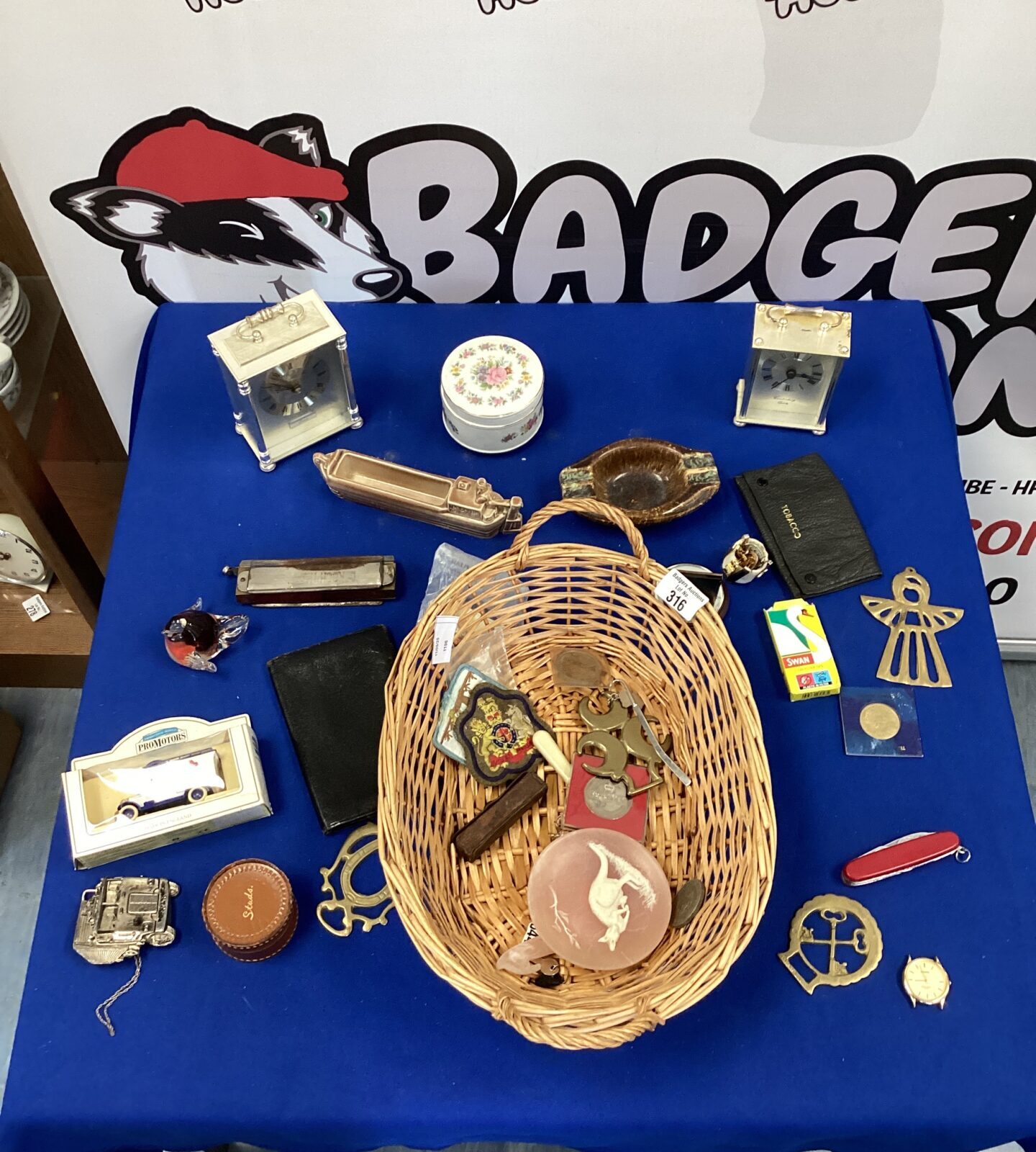 Basket of mixed items inc two carriage clocks
