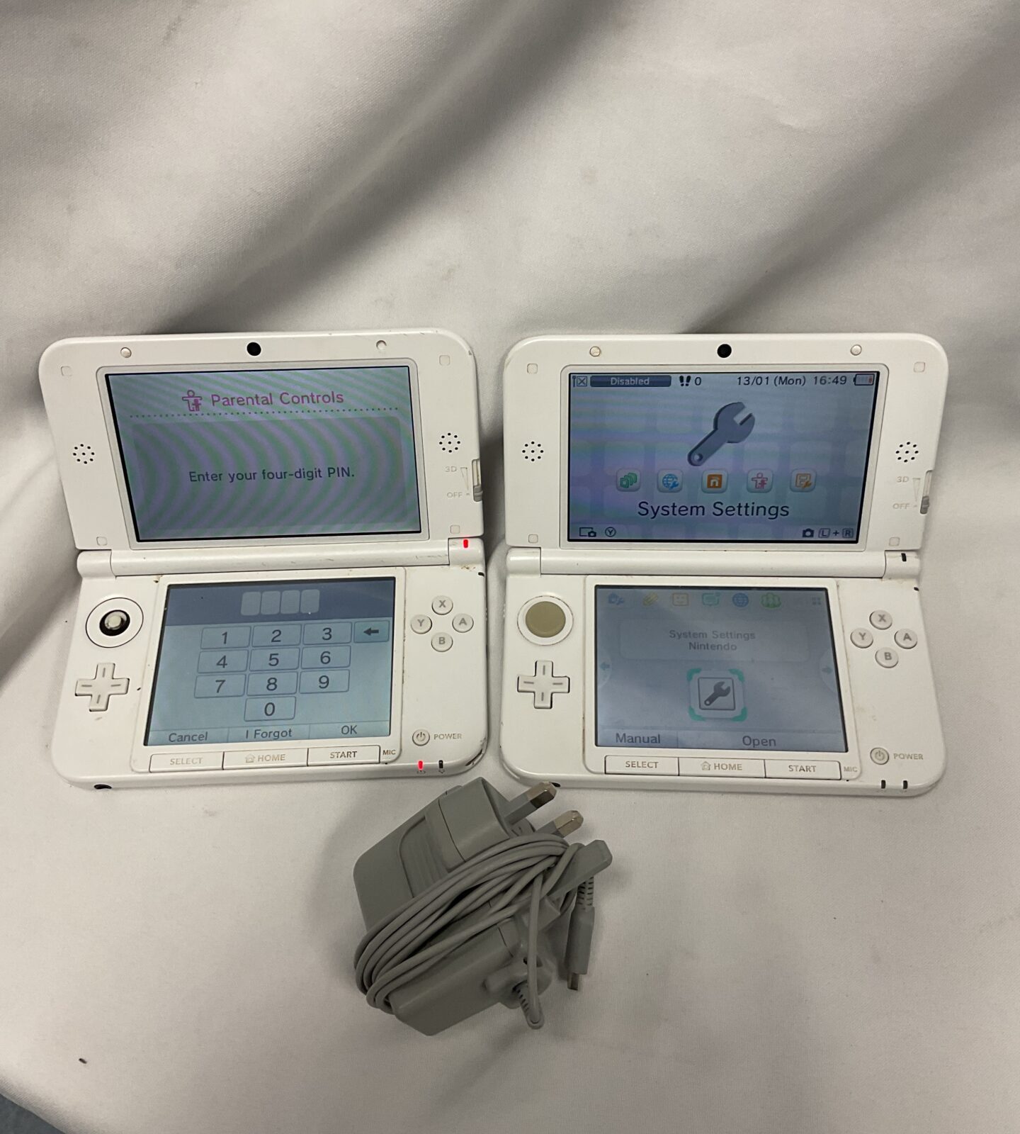 Two nintendo 3ds xl consoles with charger