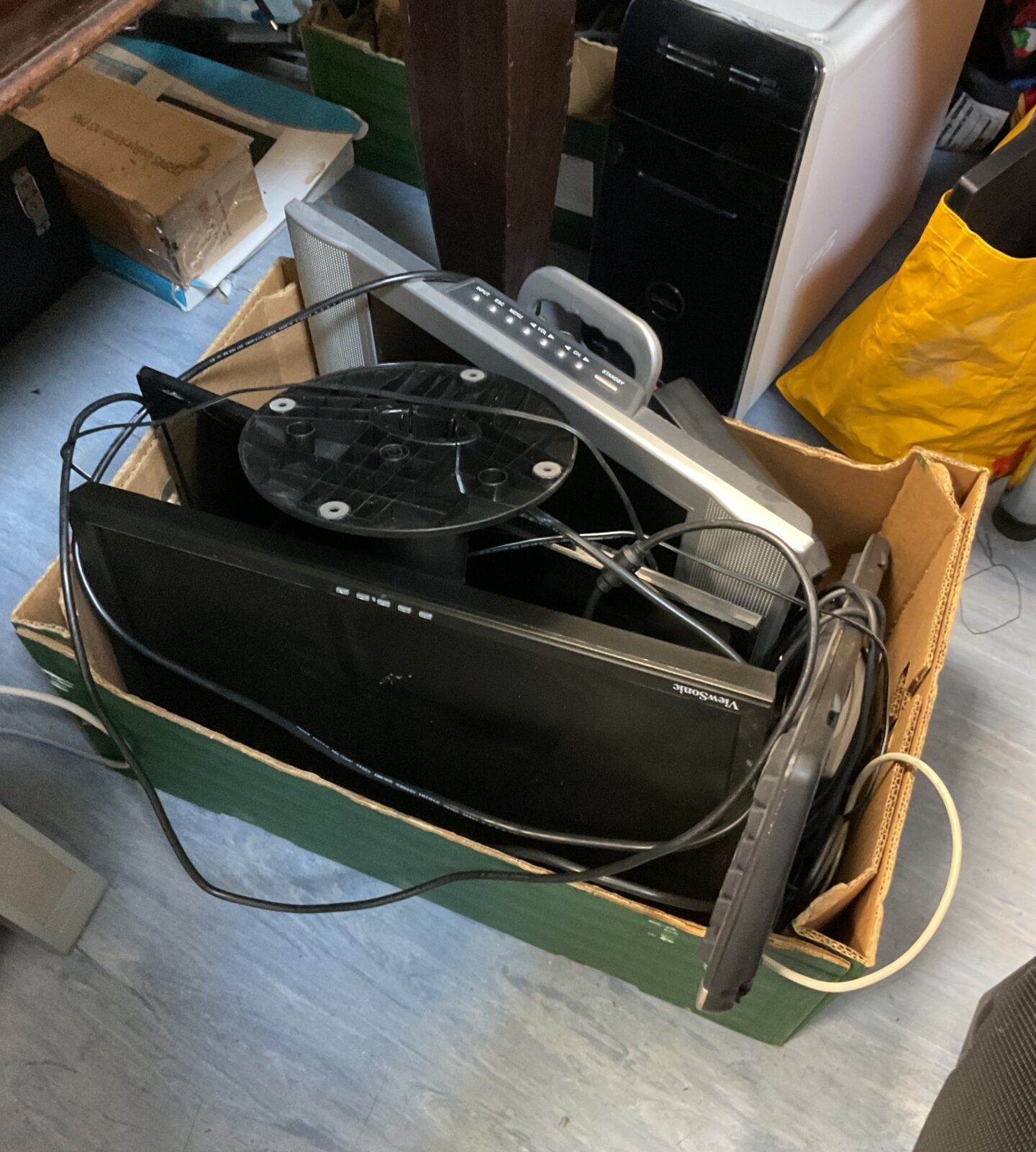 Box of computer monitors & keyboards