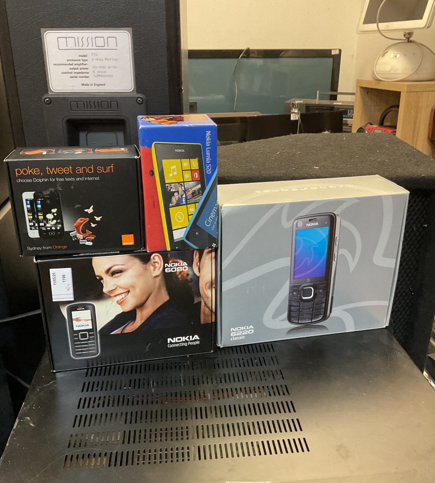 Four boxed mobile phones inc nokia