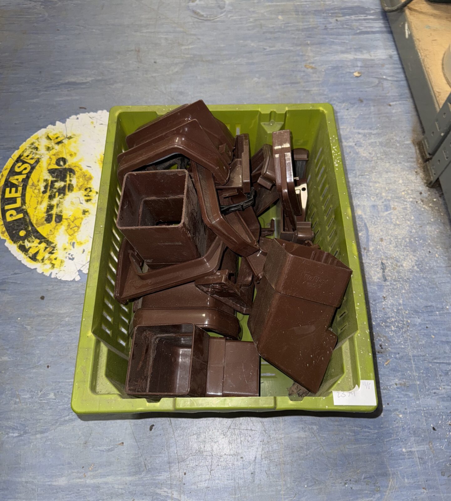 Basket of brown drainpipe fittings
