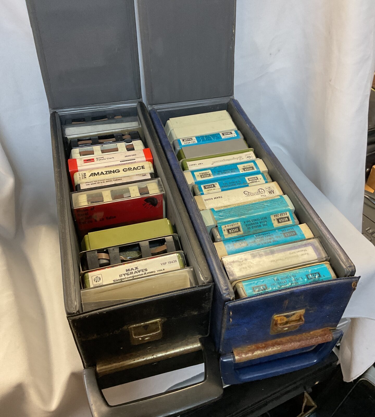 Two cases of 8 track music cassettes